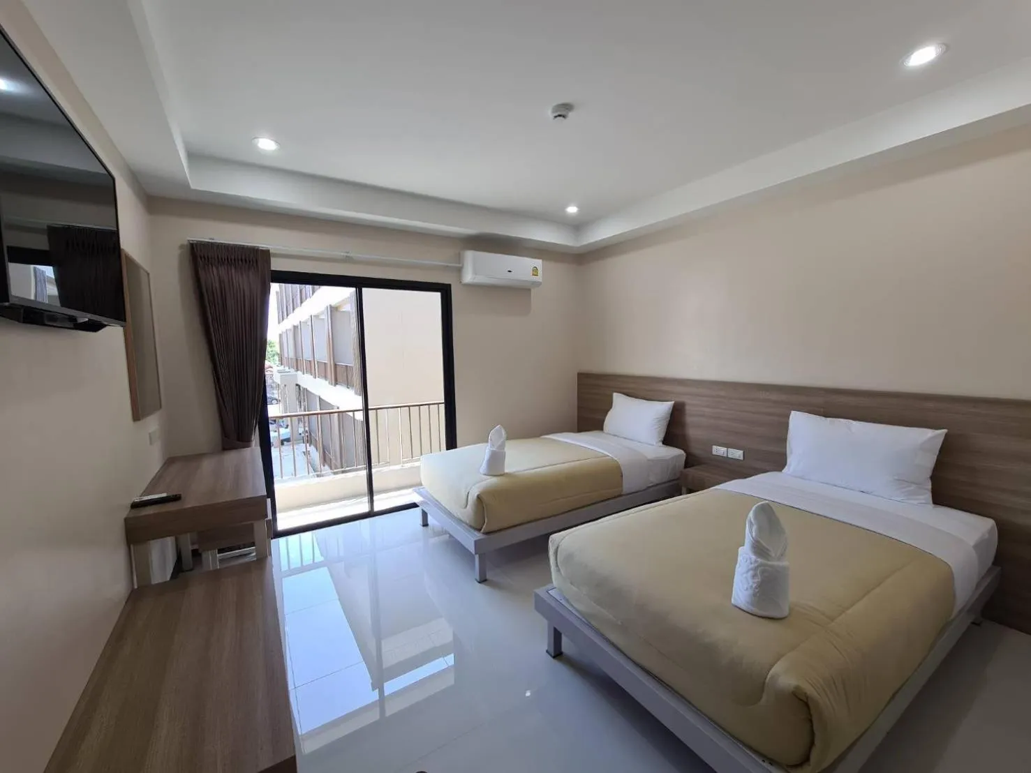 Bed in Grand Maihom Hotel