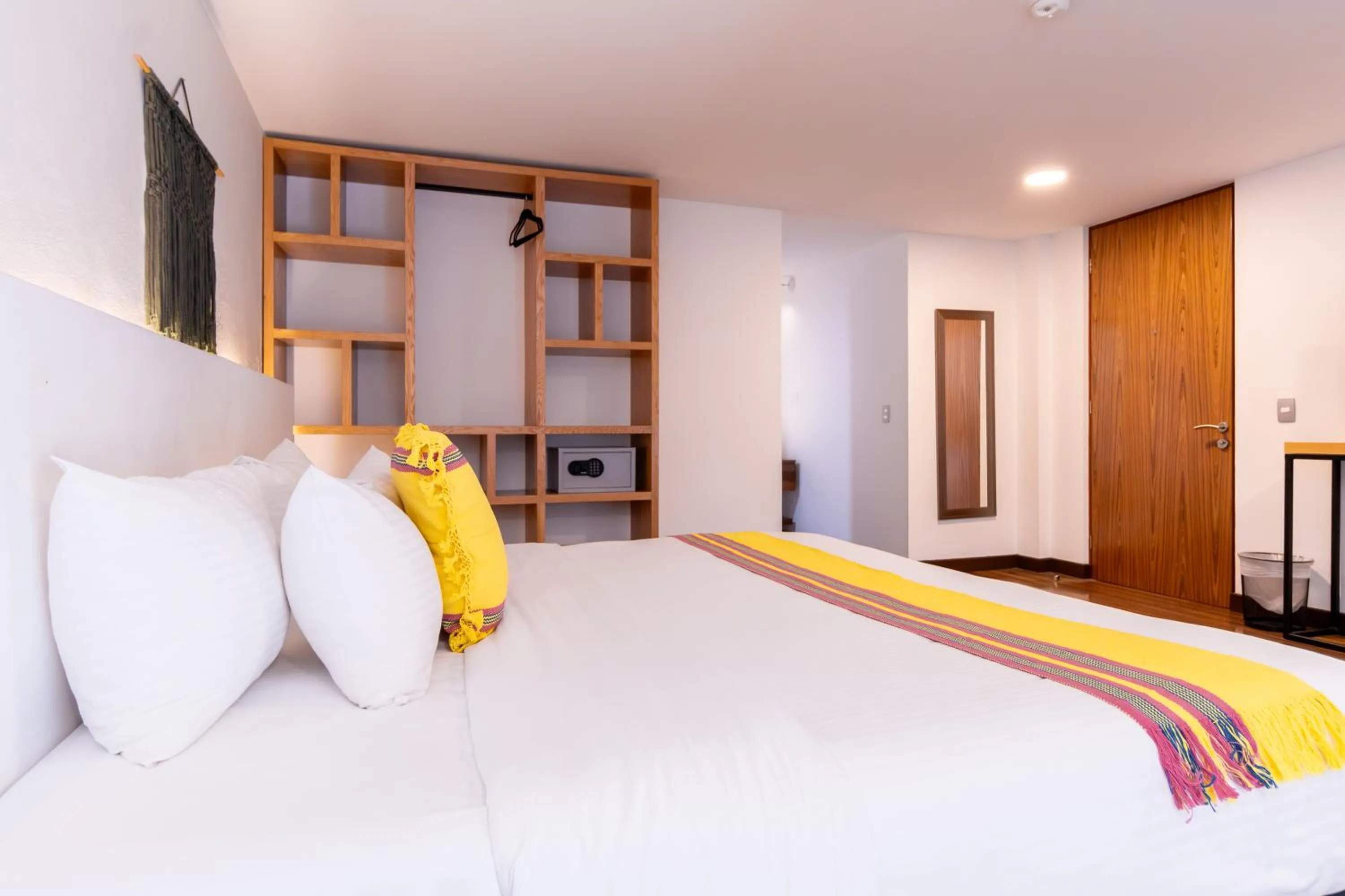 Bed in Urban Puebla by Grupo Amber