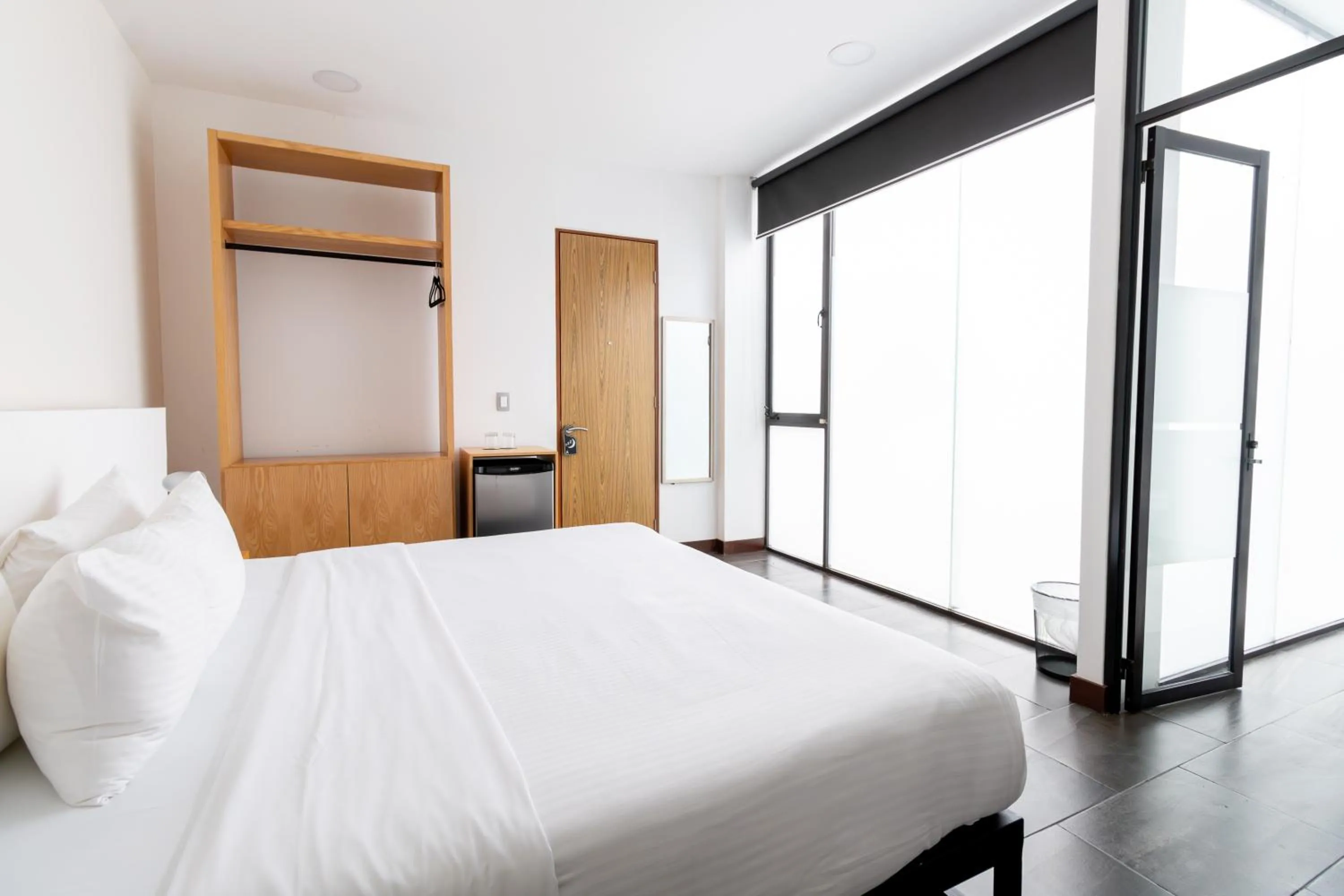 Bed in Urban Puebla by Grupo Amber