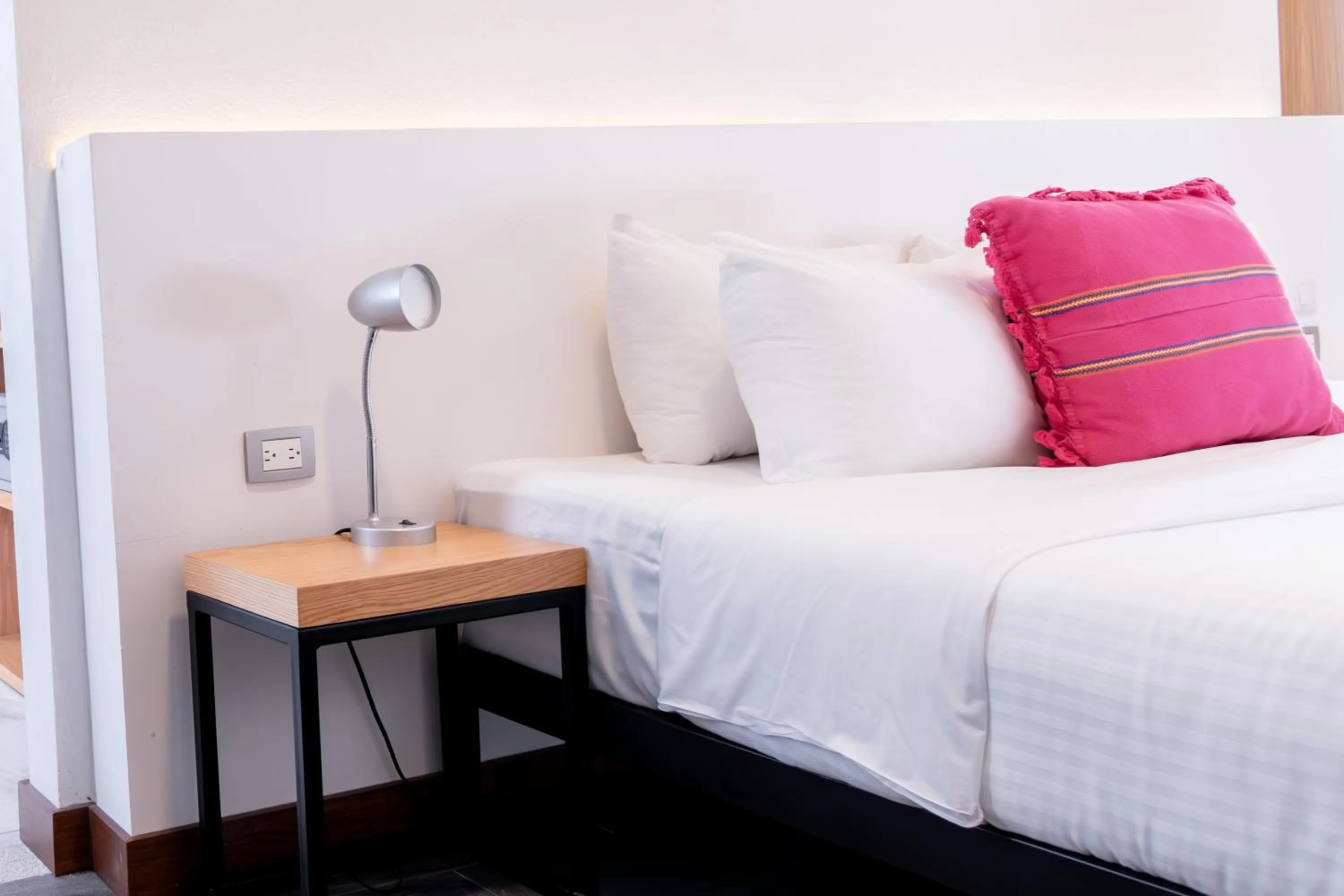 Bed in Urban Puebla by Grupo Amber