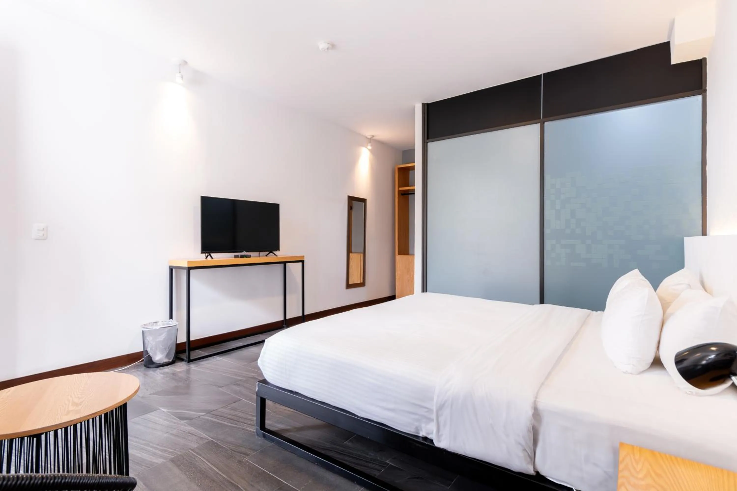 Bed in Urban Puebla by Grupo Amber