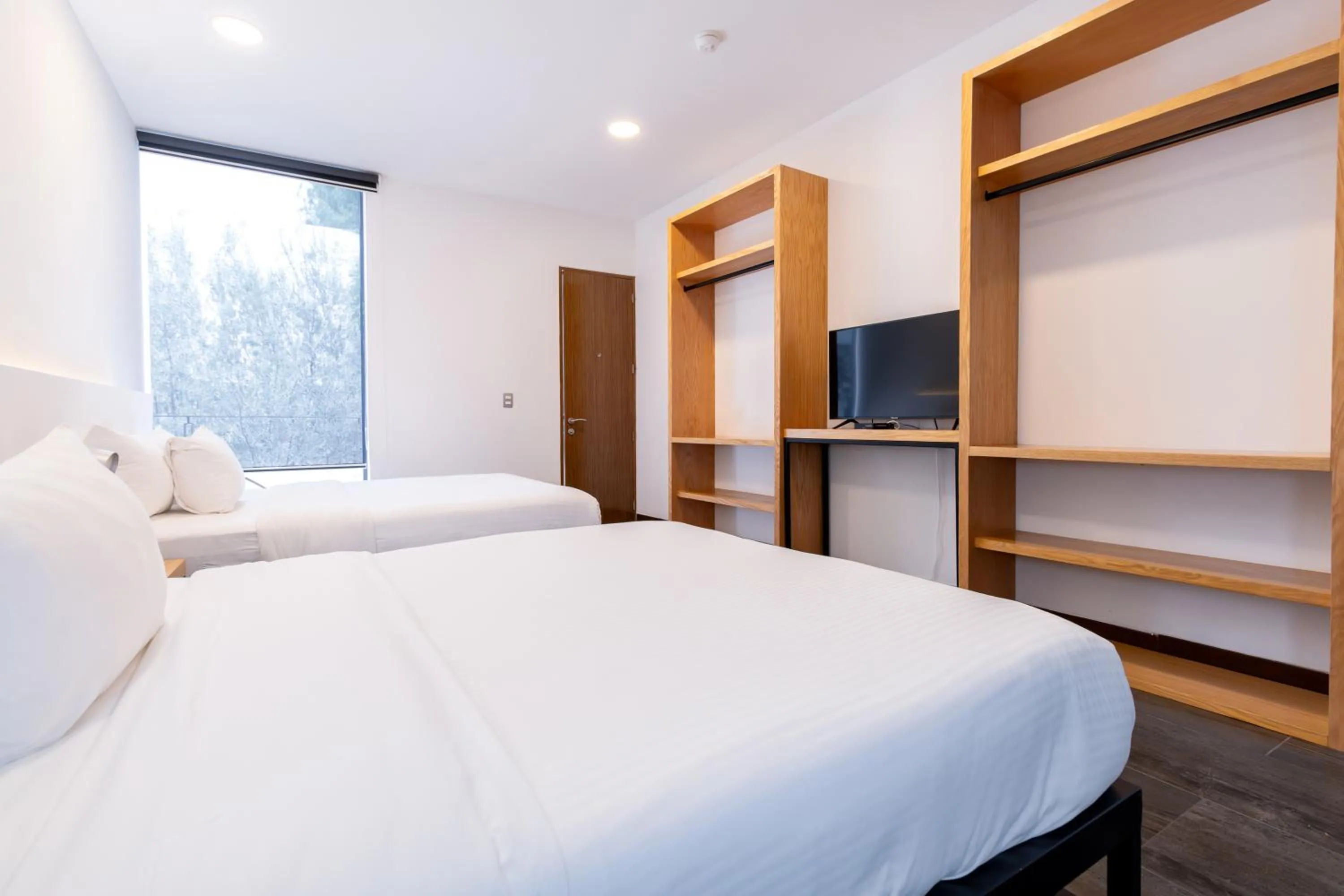 Bed in Urban Puebla by Grupo Amber