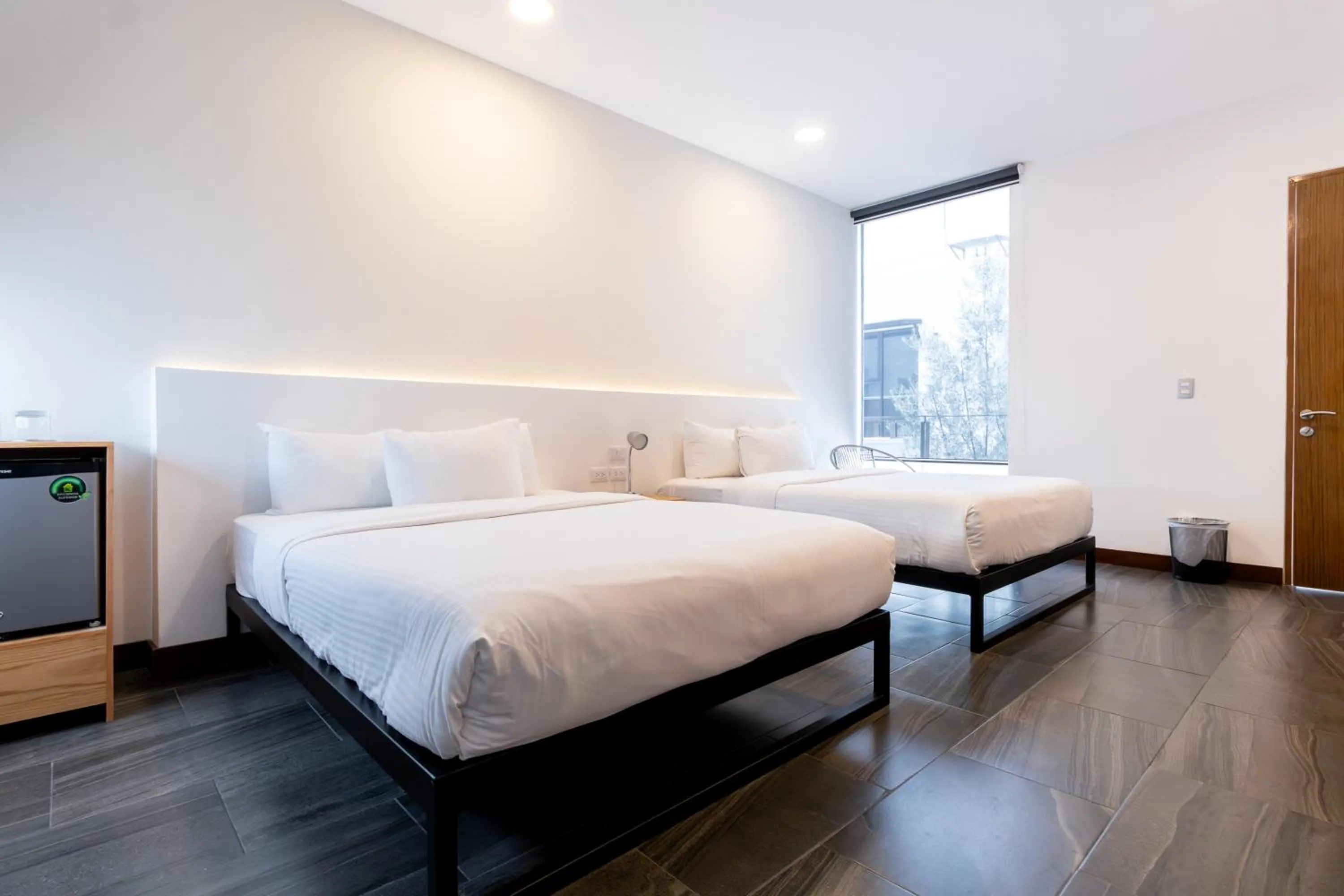 Bed in Urban Puebla by Grupo Amber