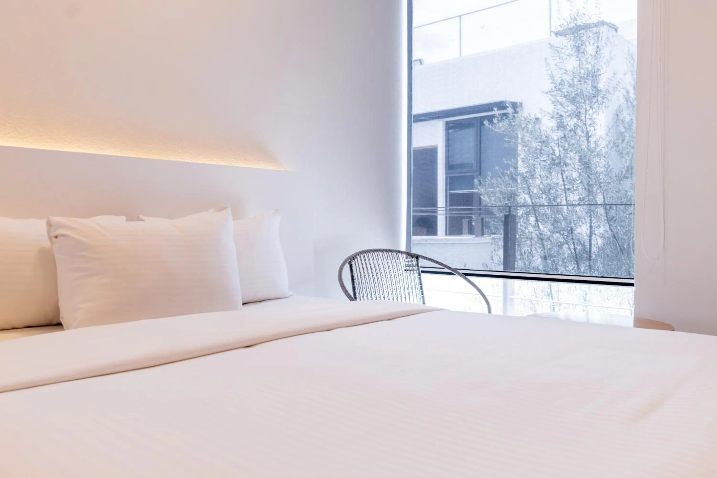 Bed in Urban Puebla by Grupo Amber