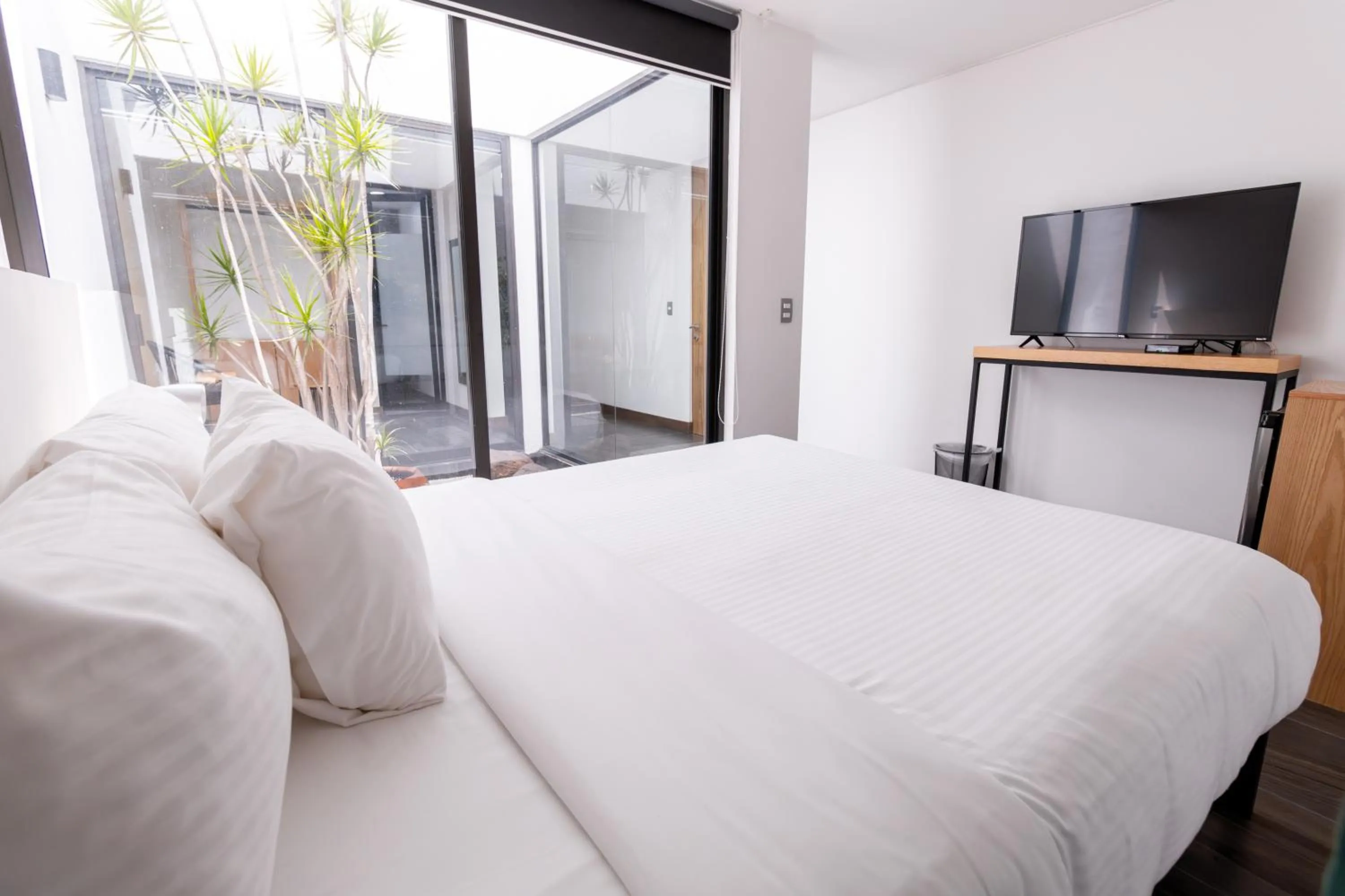 Bed in Urban Puebla by Grupo Amber