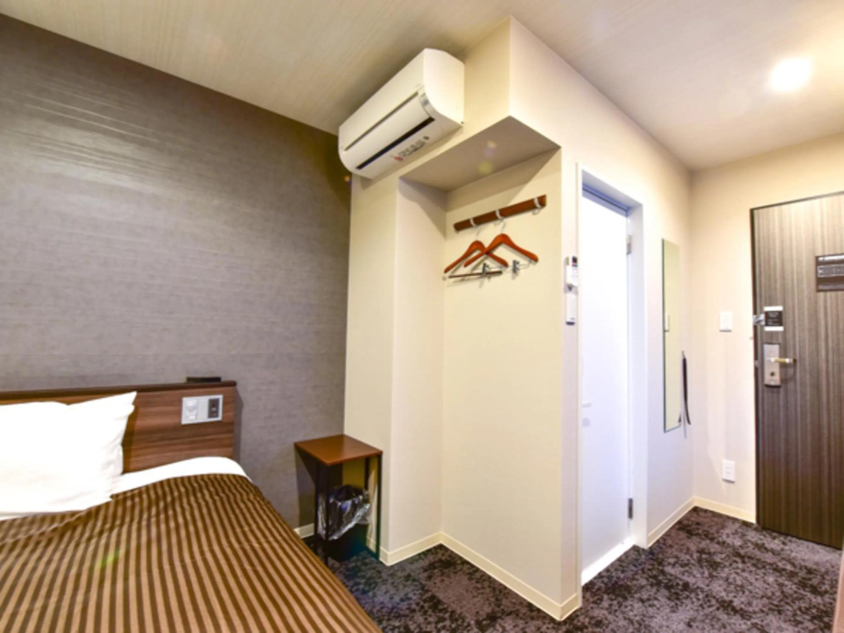 Bed in HOTEL LiVEMAX Fukuoka Tenjin West