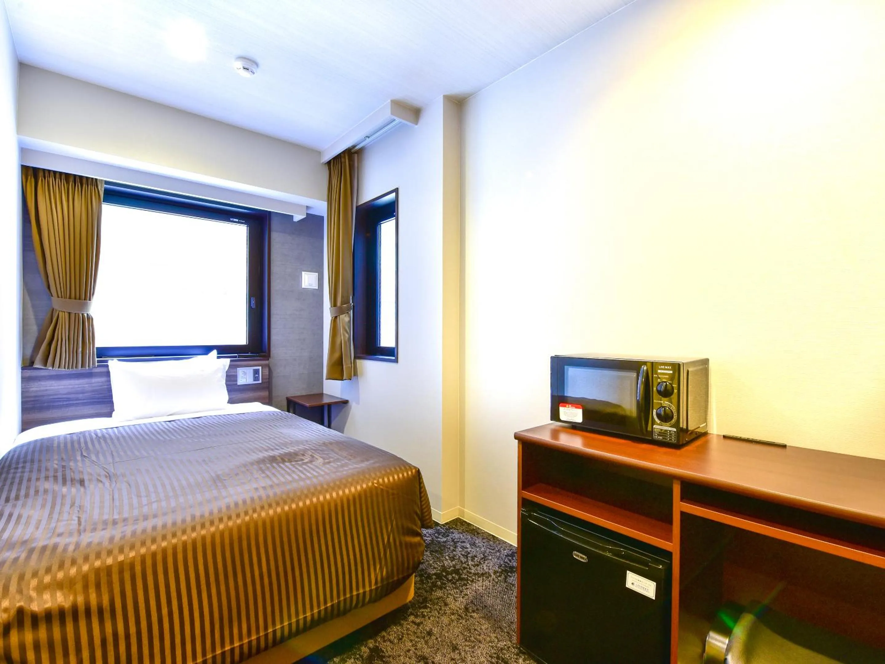 Bed in HOTEL LiVEMAX Fukuoka Tenjin West