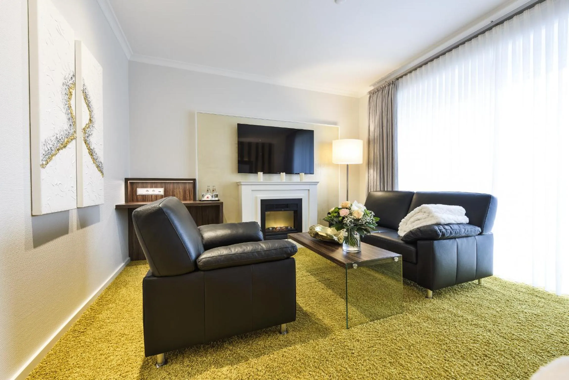 Communal lounge/ TV room in See und Sporthotel Ankum mit Lakeside Apartments