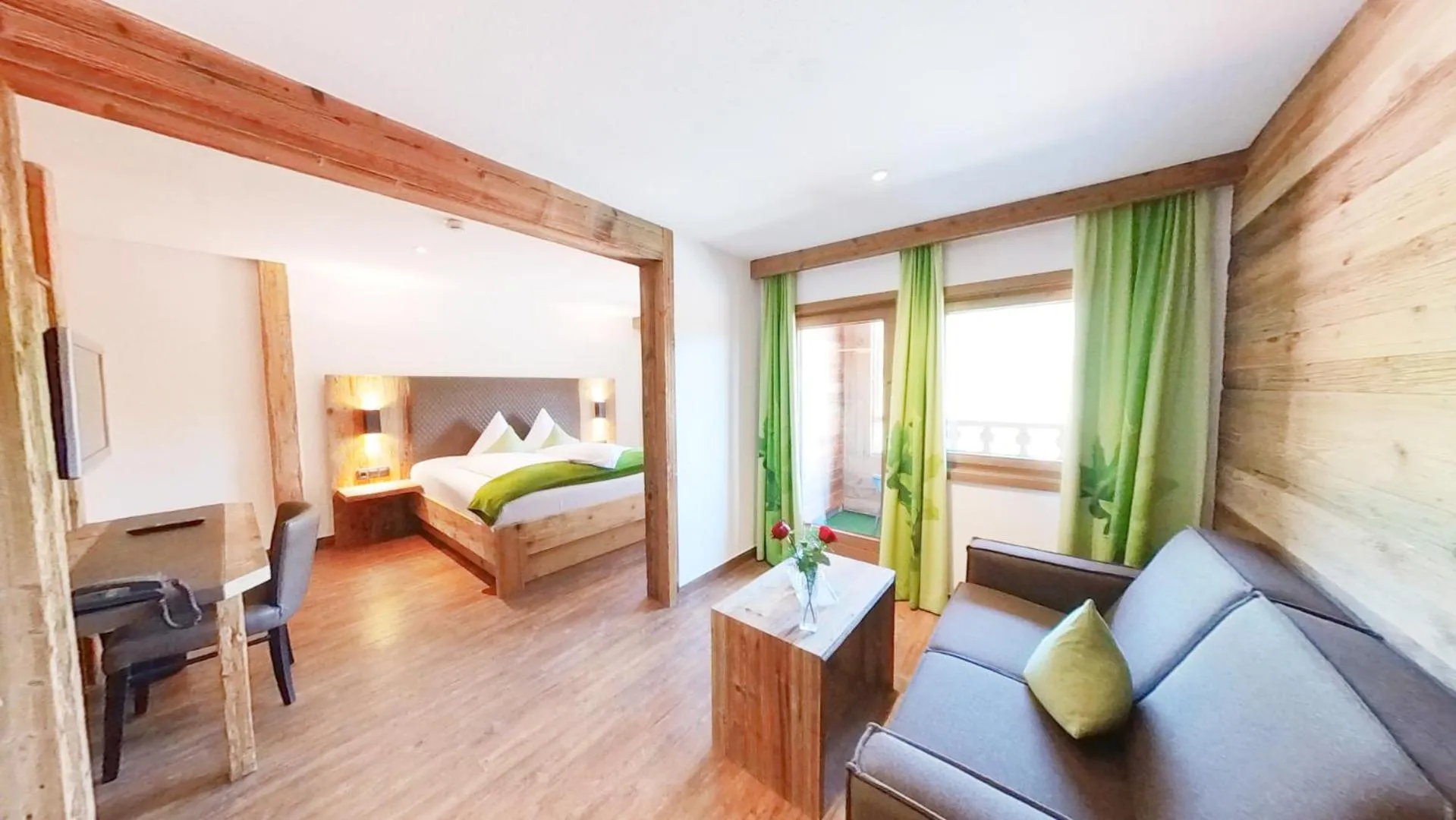 Living room, Bed in Feuriger Tatzlwurm Berghotel & Spa, BW Signature Collection