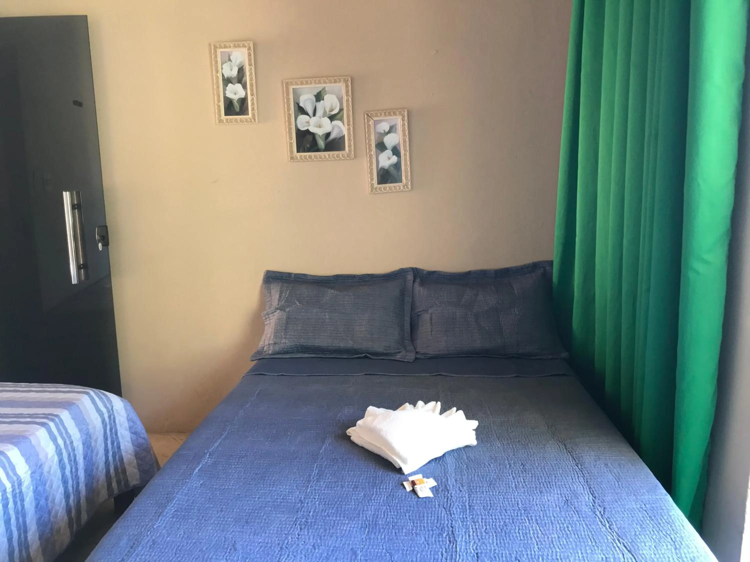 Bed in Pousada Floripes