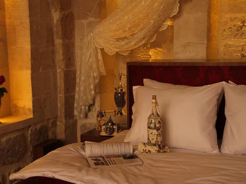 Bed in Tuğhan Hotel