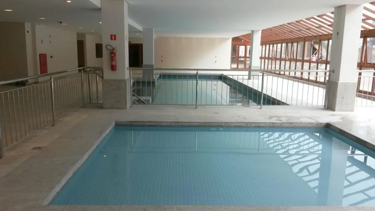 Swimming pool in Suíte Charmosa em Pedra Azul