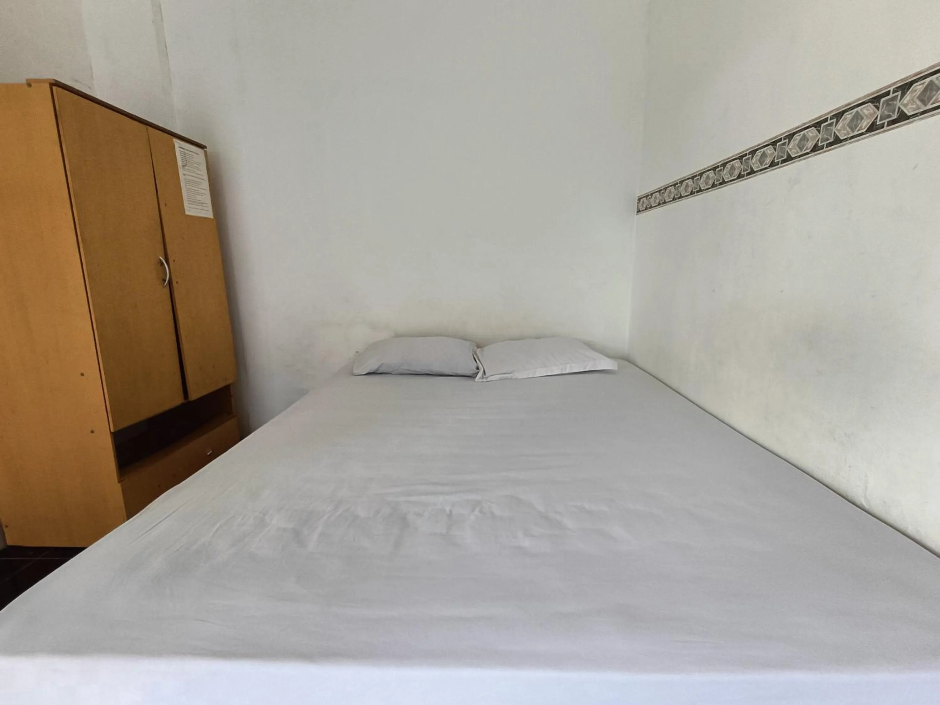 Bed in Bumi Merpati Residence Makassar Mitra RedDoorz