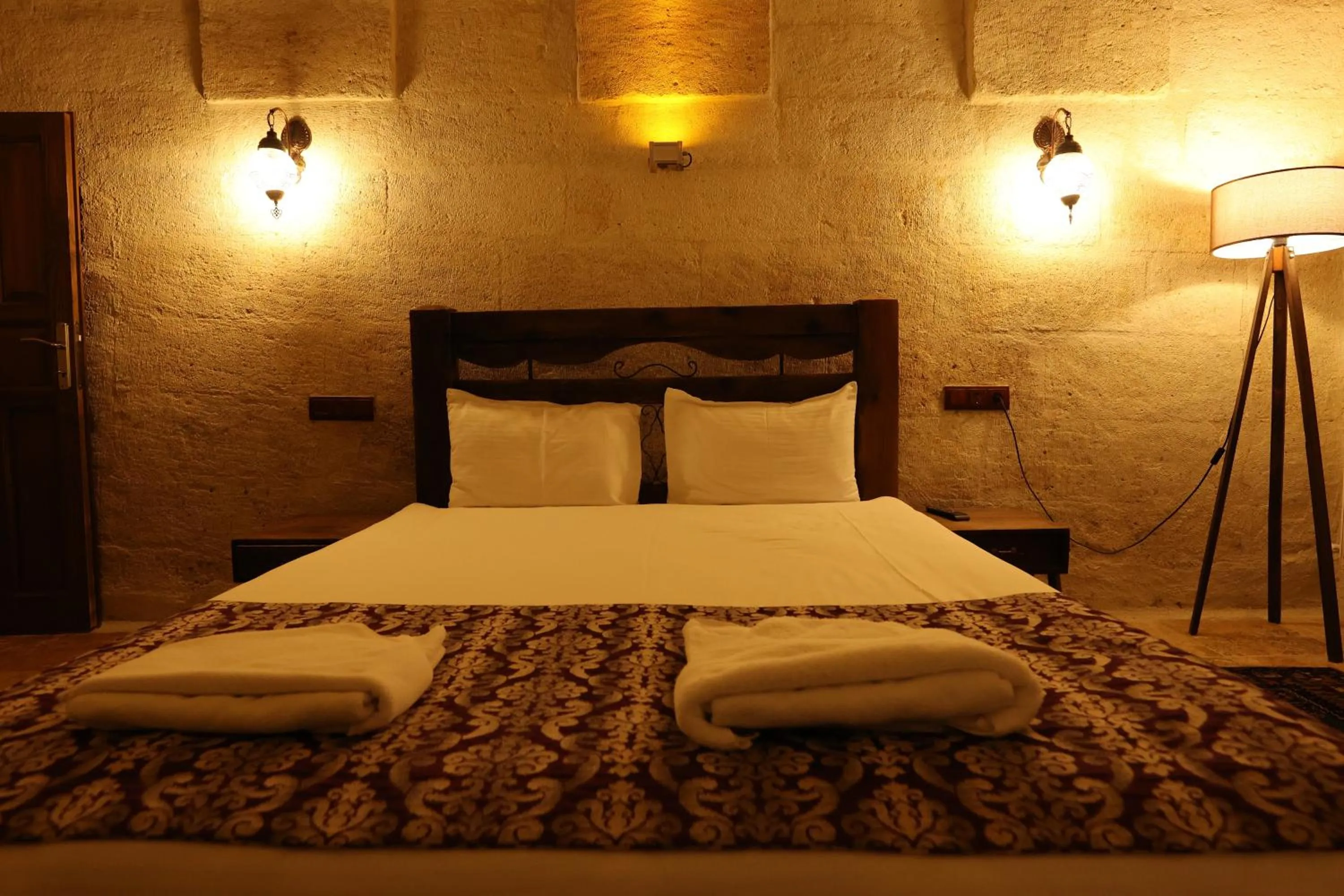 Bed in Zanta Suite Hotel