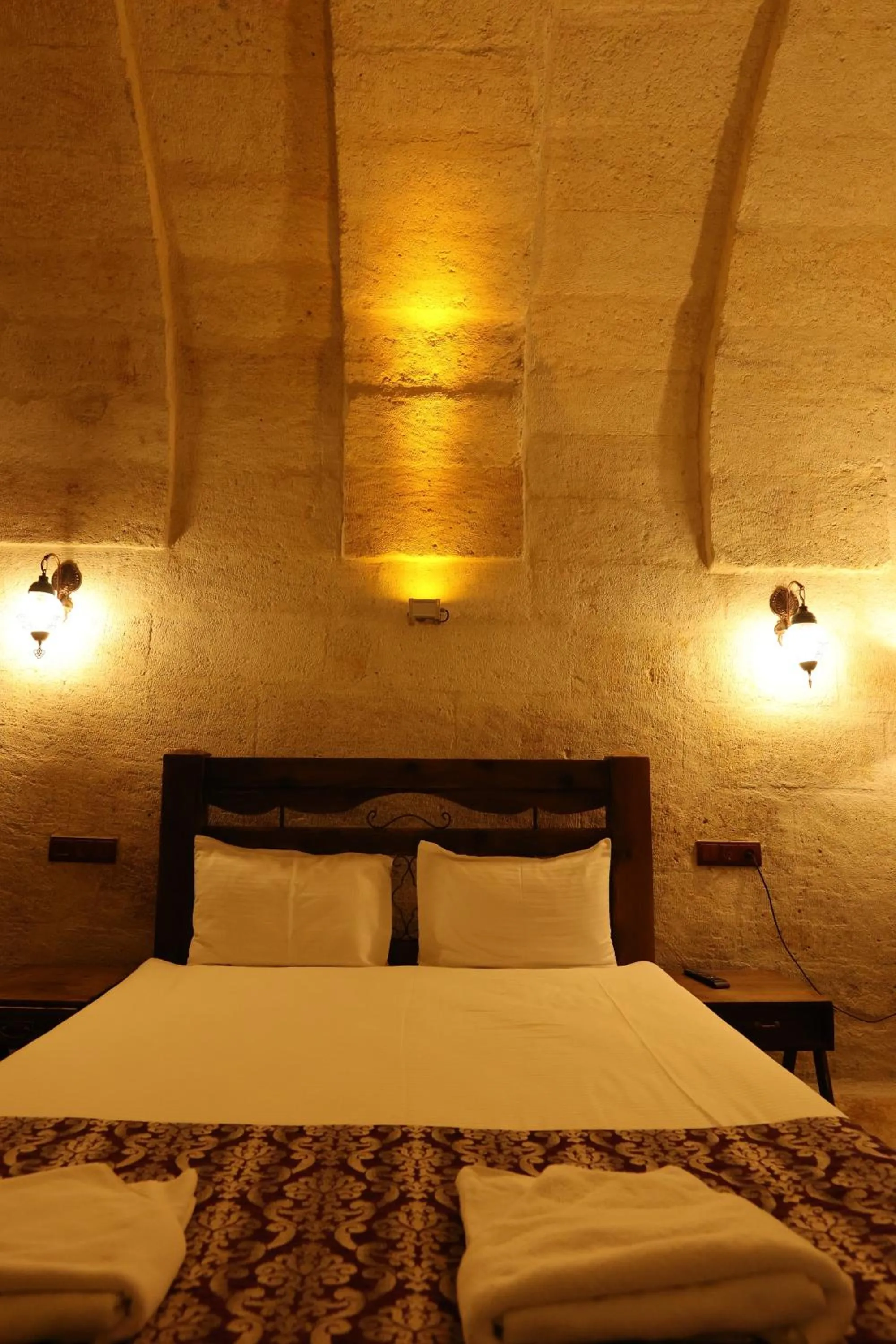 Bed in Zanta Suite Hotel