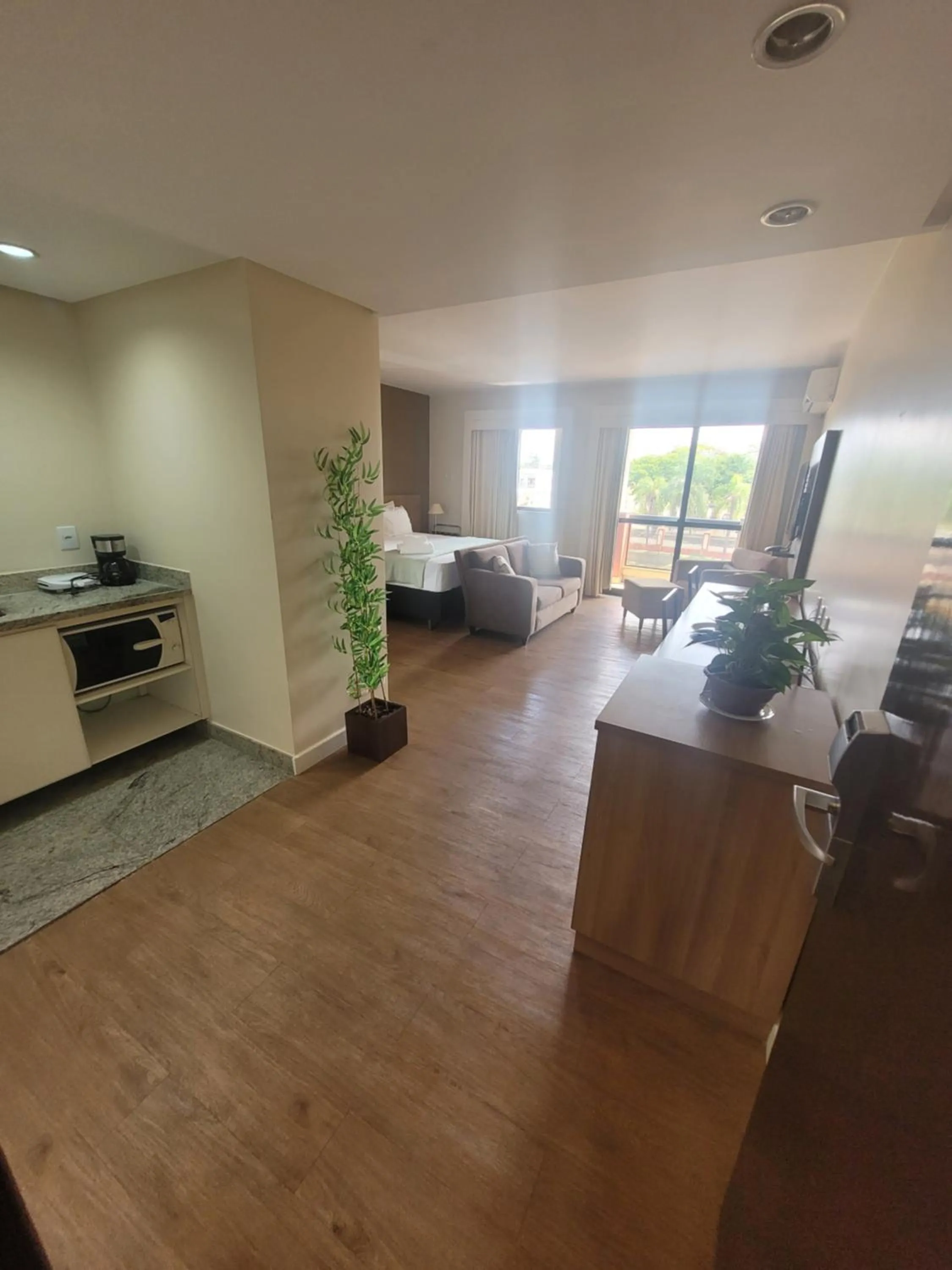 Kitchen or kitchenette in Lake Side Beira do Lago - piscina - academia - sauna- By Rei dos Flats