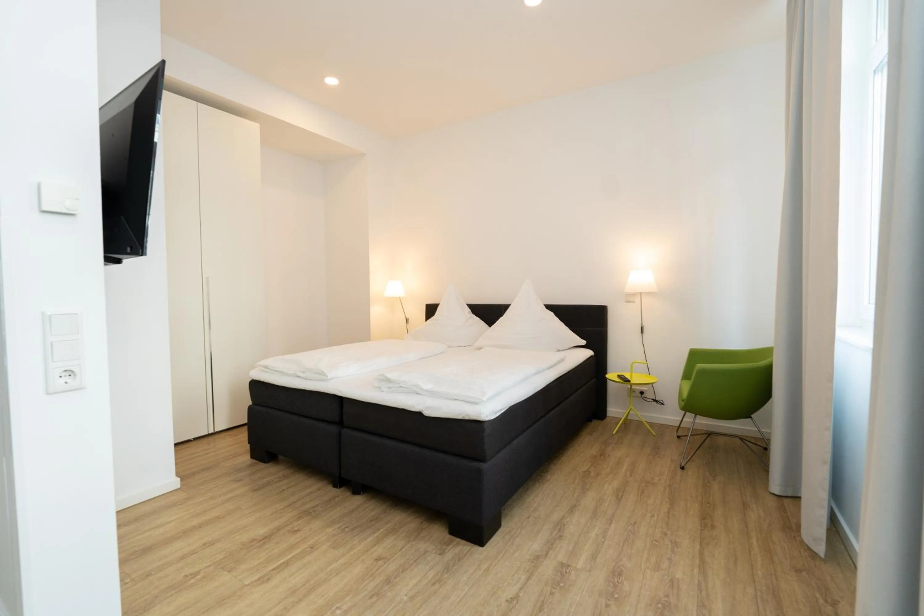 Bed in Das Loft Apartments