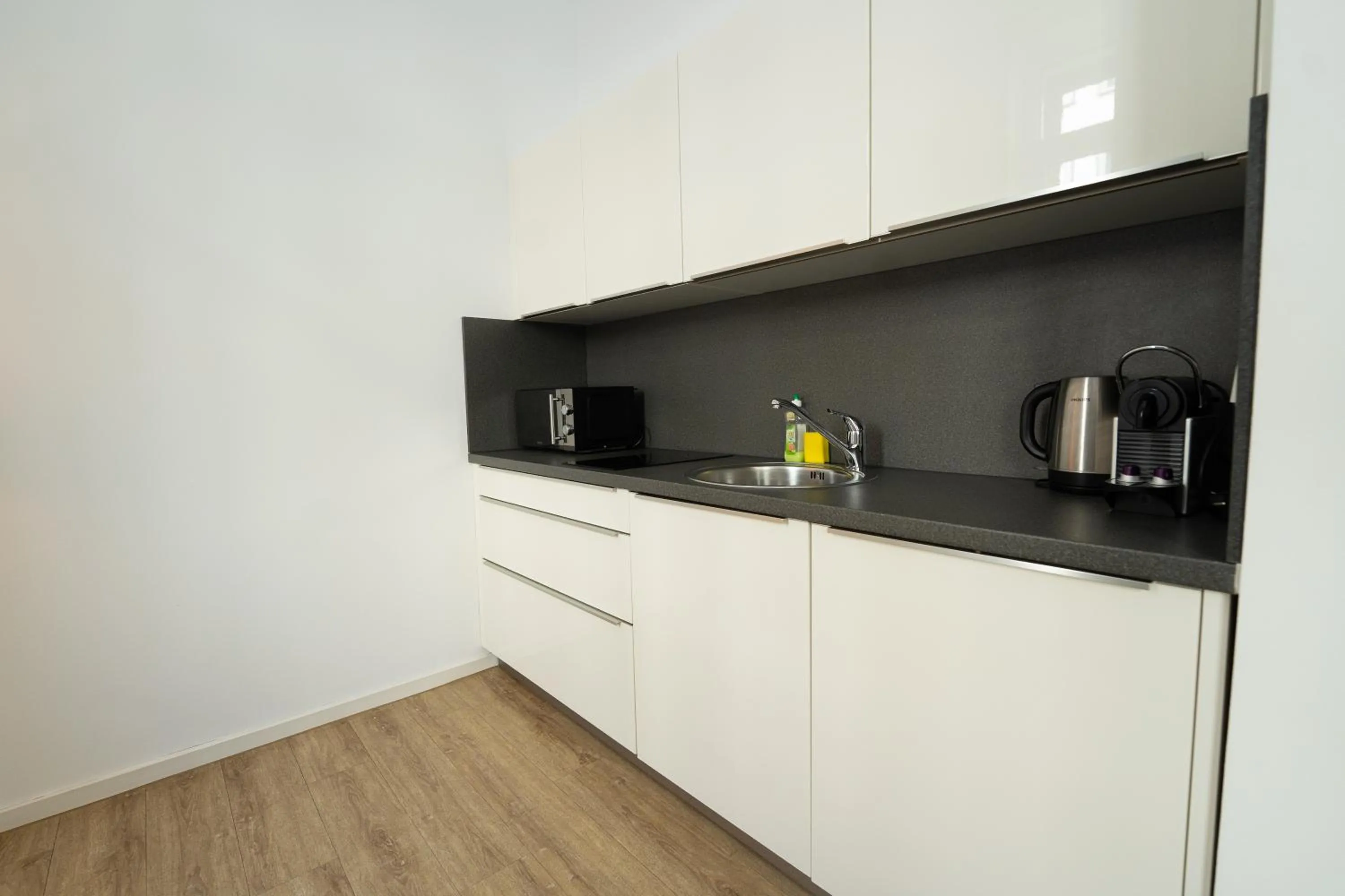 Kitchen or kitchenette in Das Loft Apartments
