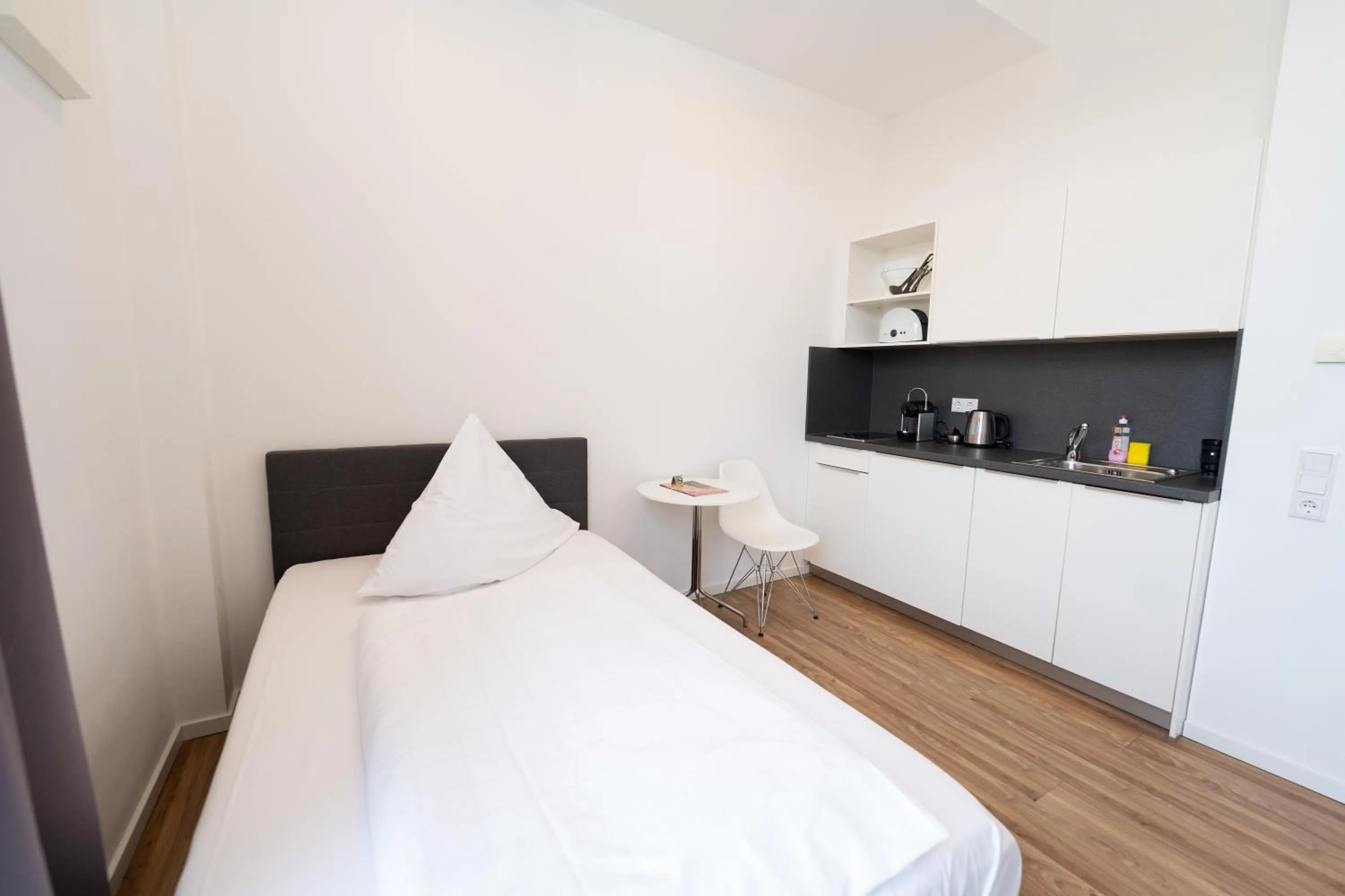 Bed in Das Loft Apartments