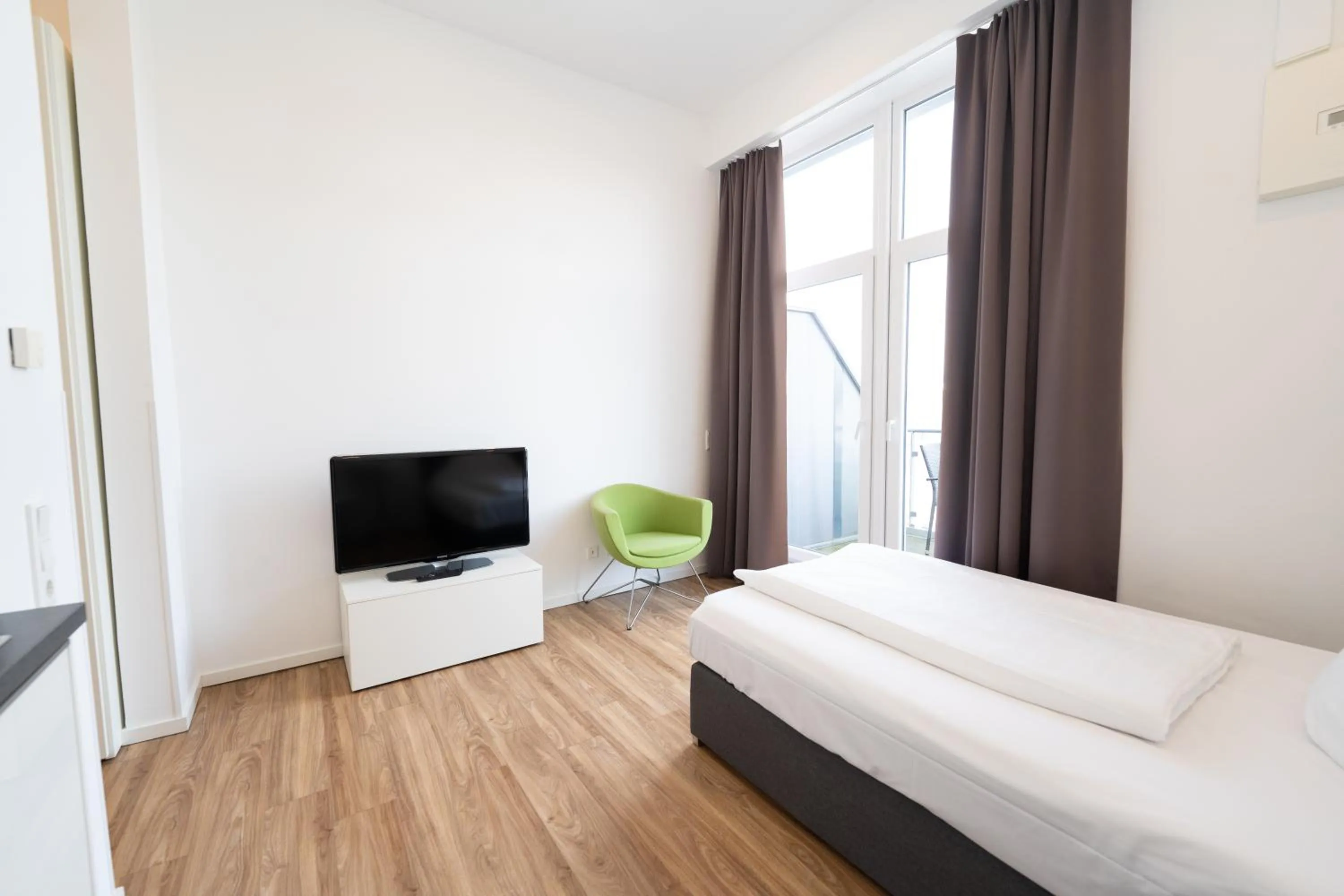 Bed in Das Loft Apartments