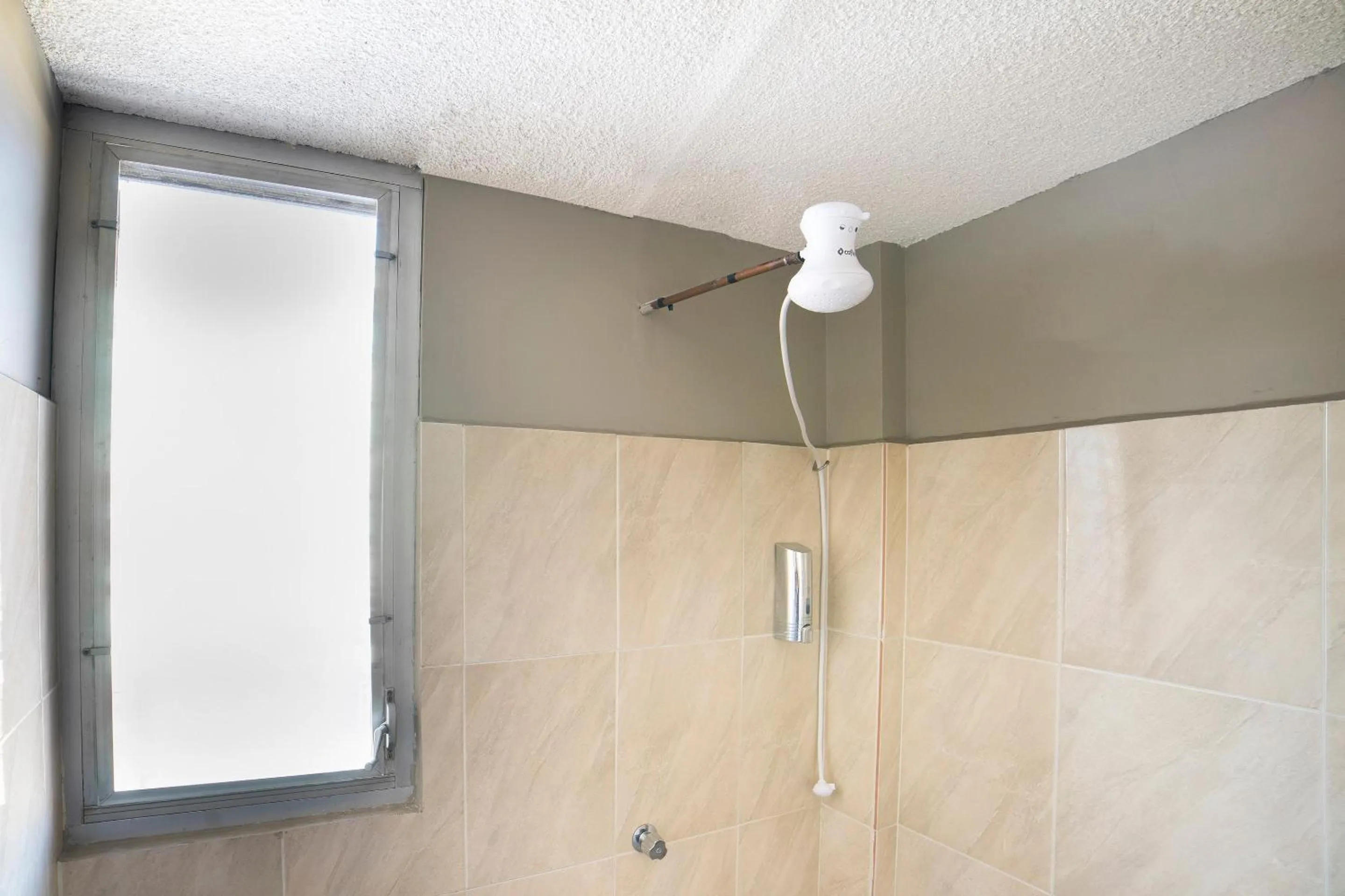 Bathroom in Capital O Hotel Diez