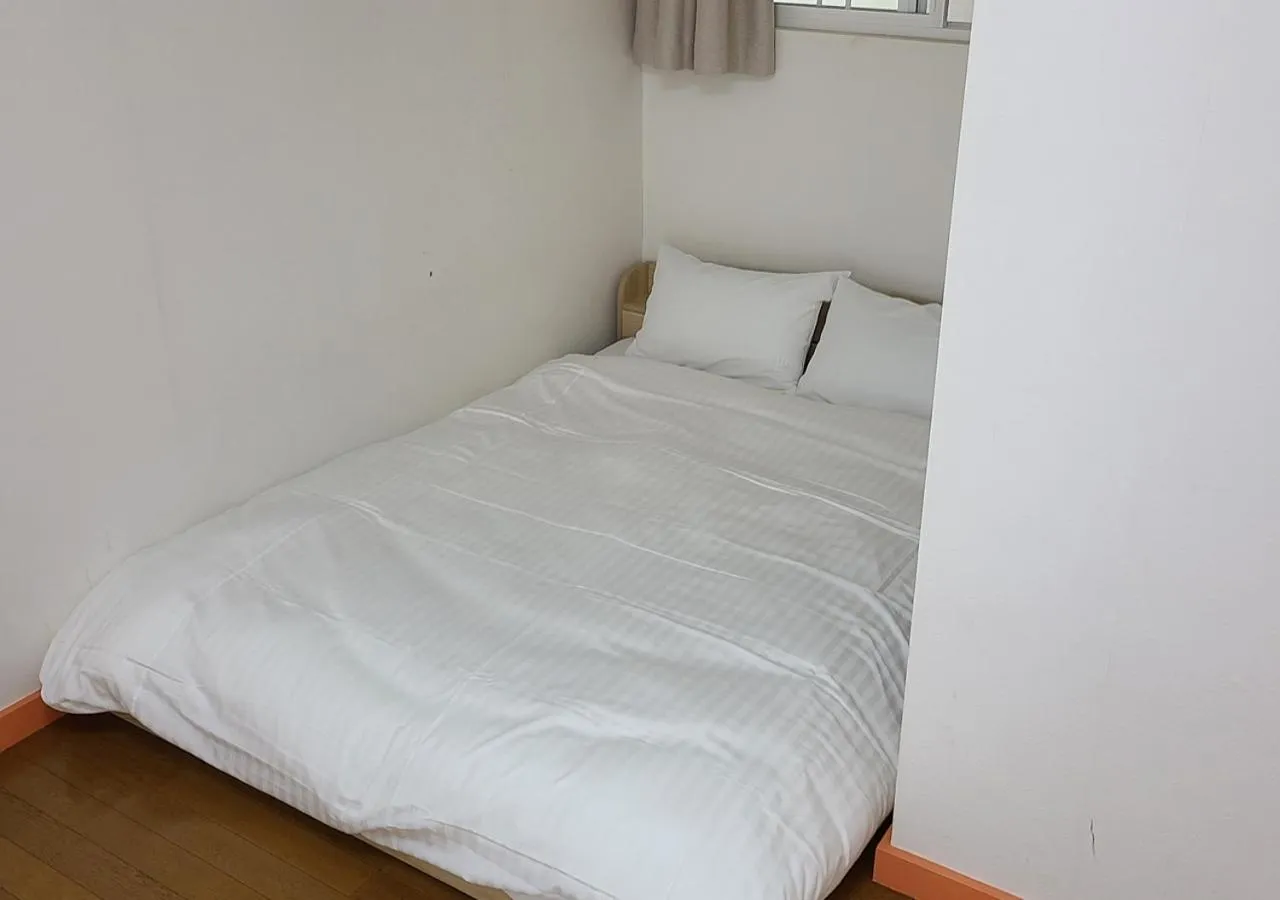 Bed in Bluebird Hotel