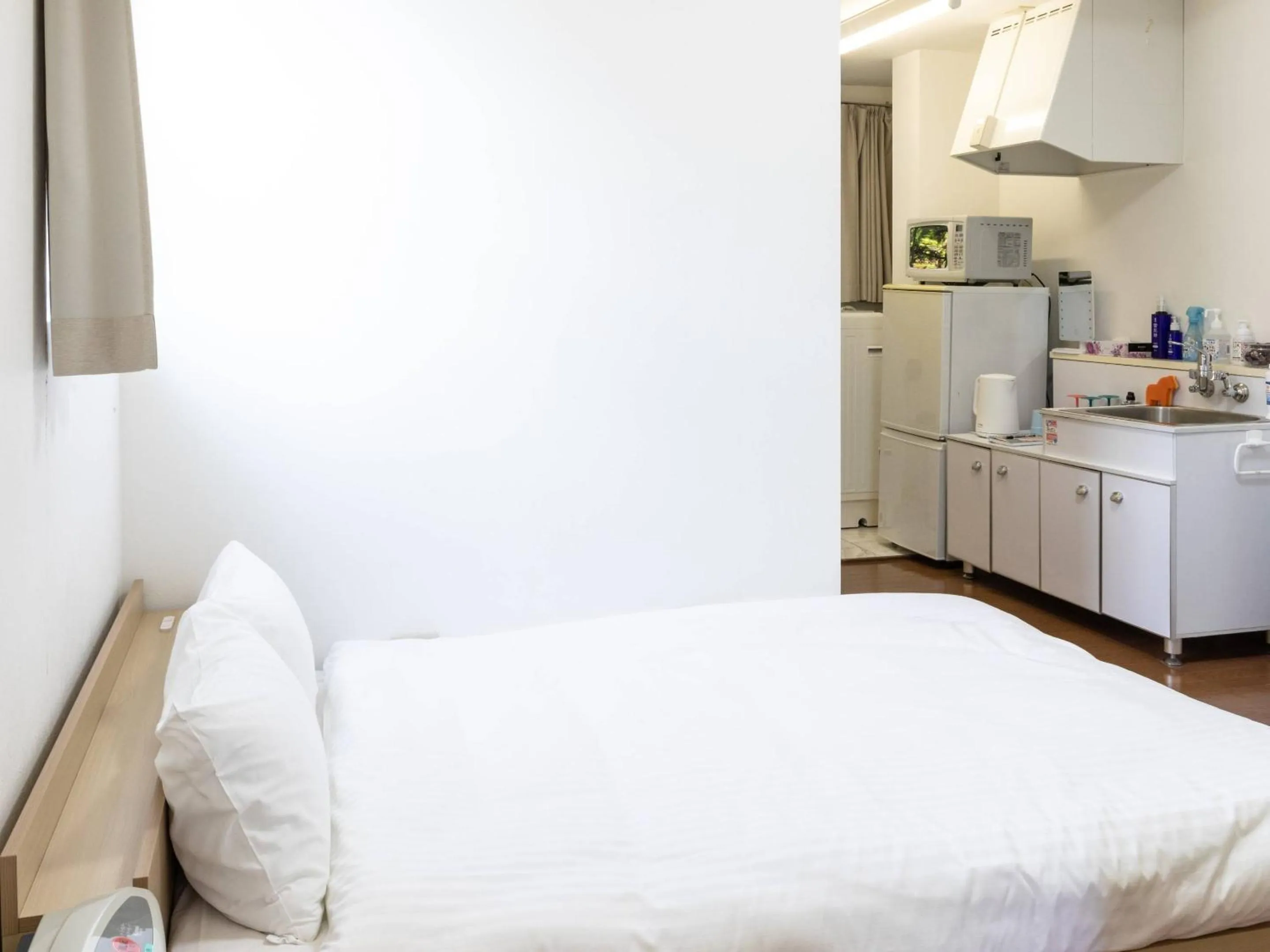 Bed in Bluebird Hotel