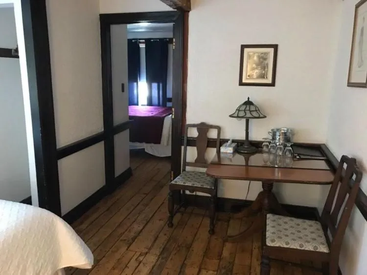 Bed in The Olde Angel Inn