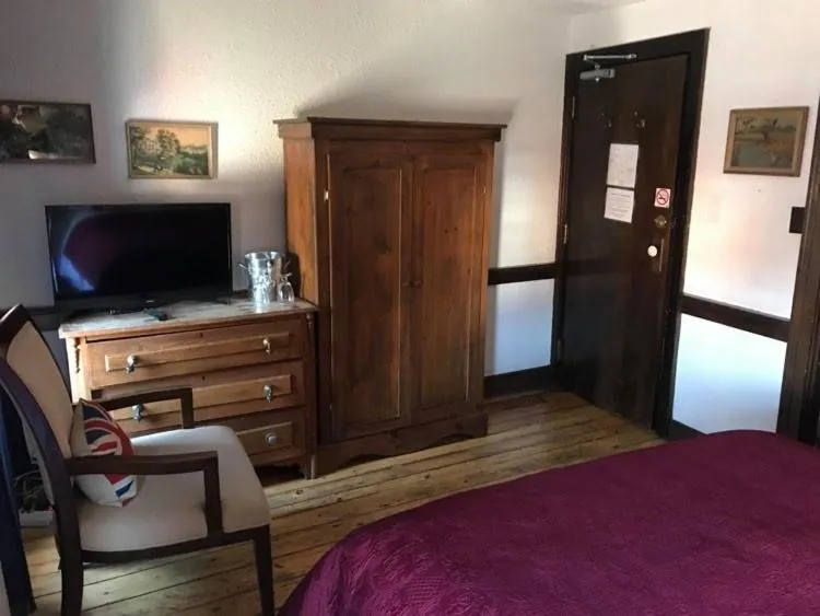 Bed in The Olde Angel Inn