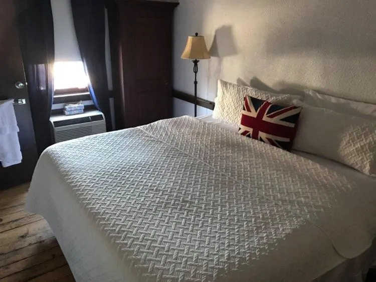 Bed in The Olde Angel Inn