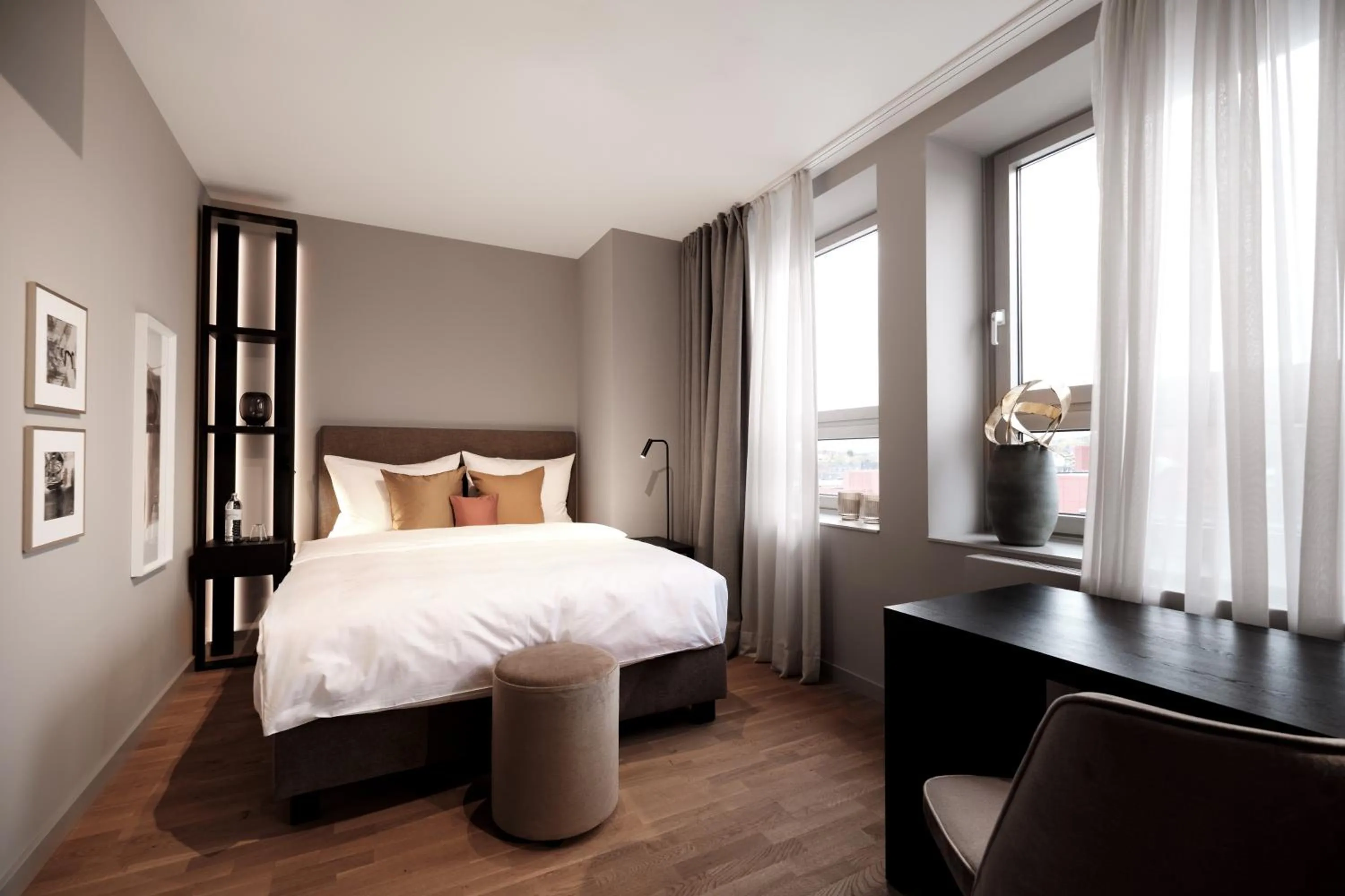 Living room, Bed in SAXX Hotel "Am Theater Karree"