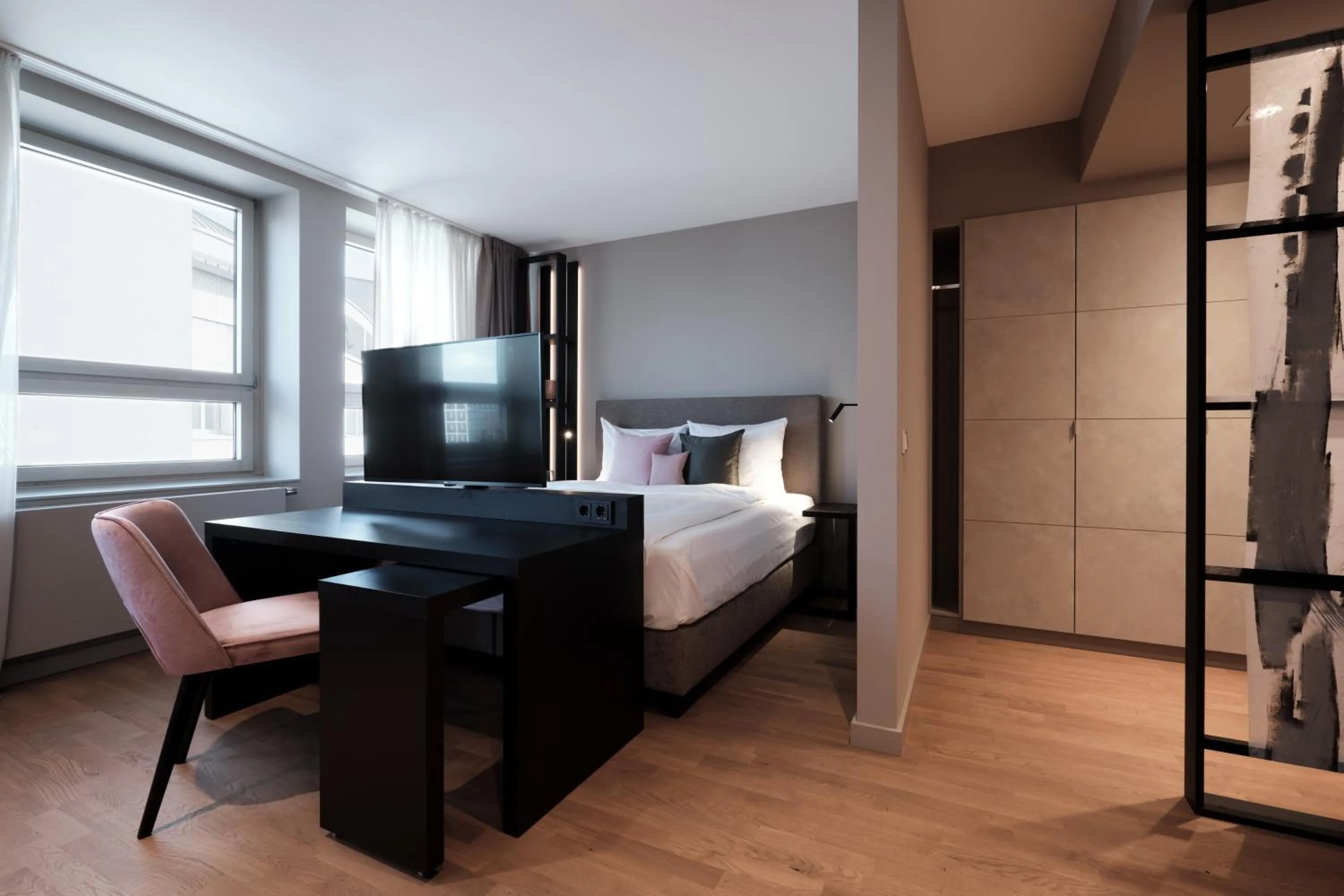 Living room, Bed in SAXX Hotel "Am Theater Karree"