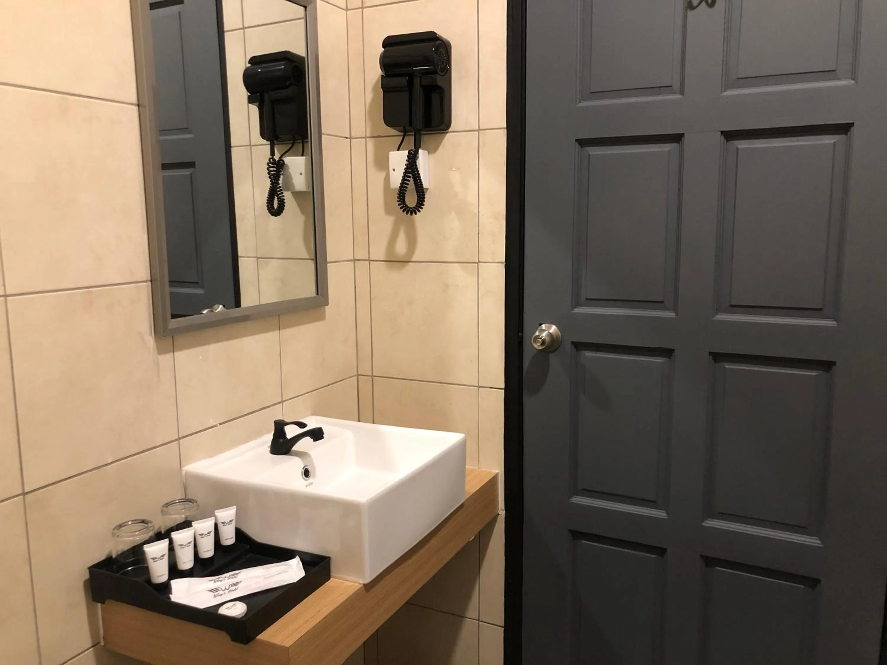 Toilet in Wings Hotel