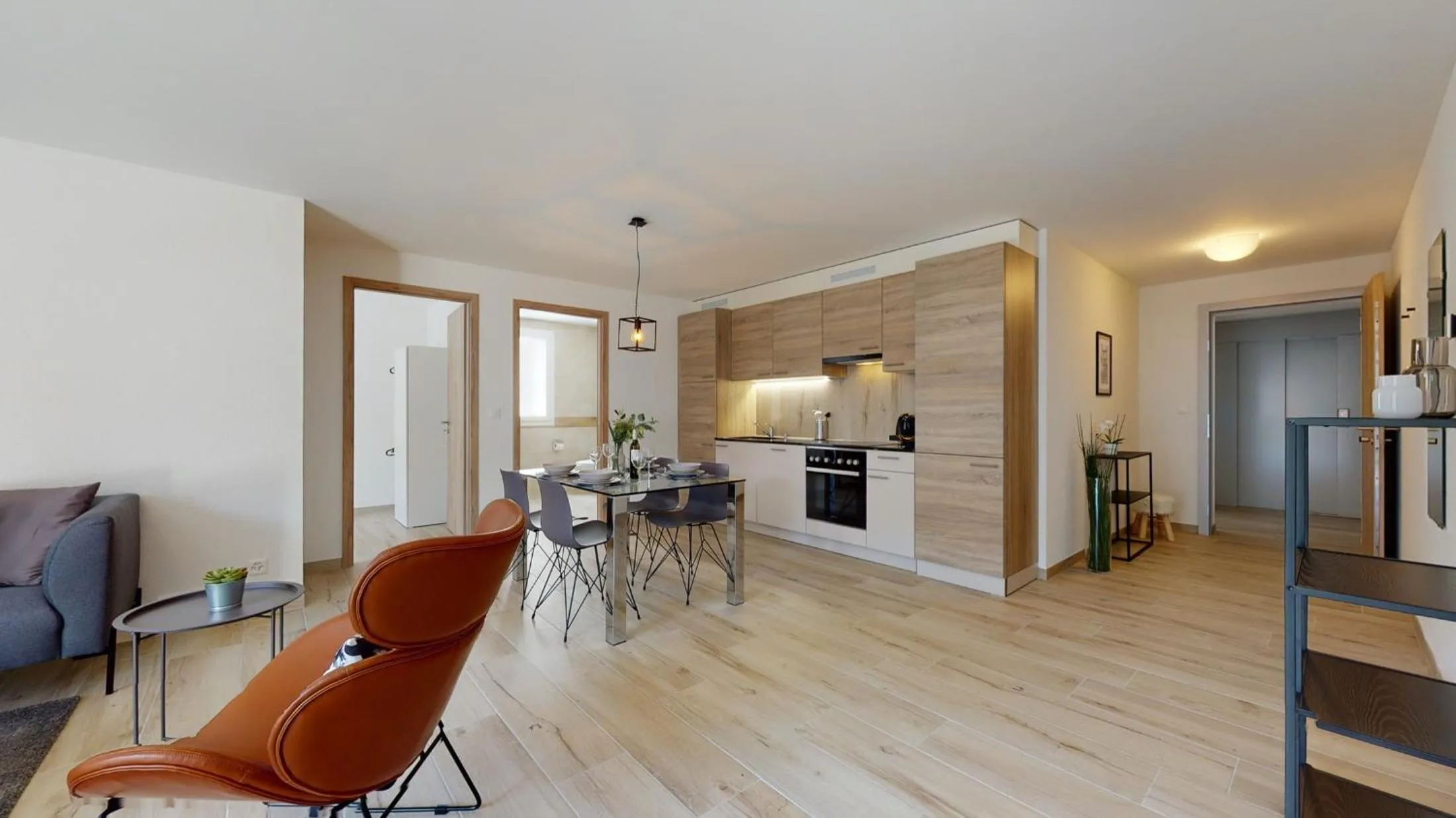 Kitchen or kitchenette in Nonanteneuf appart hōtel Aigle - contactless check-in