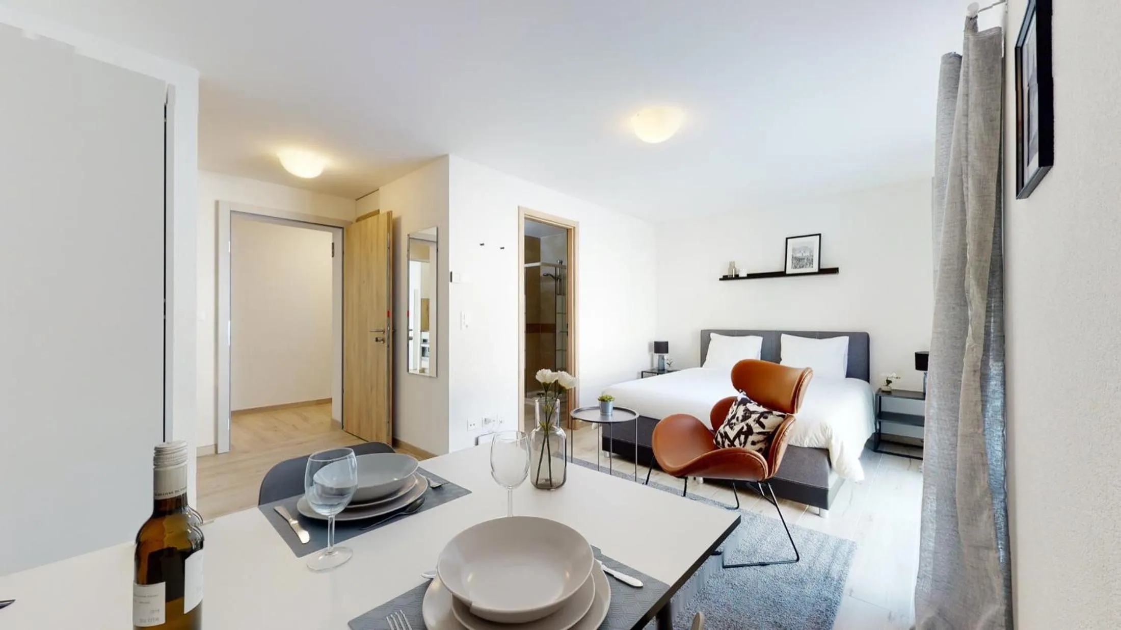 Bedroom in Nonanteneuf appart hōtel Aigle - contactless check-in