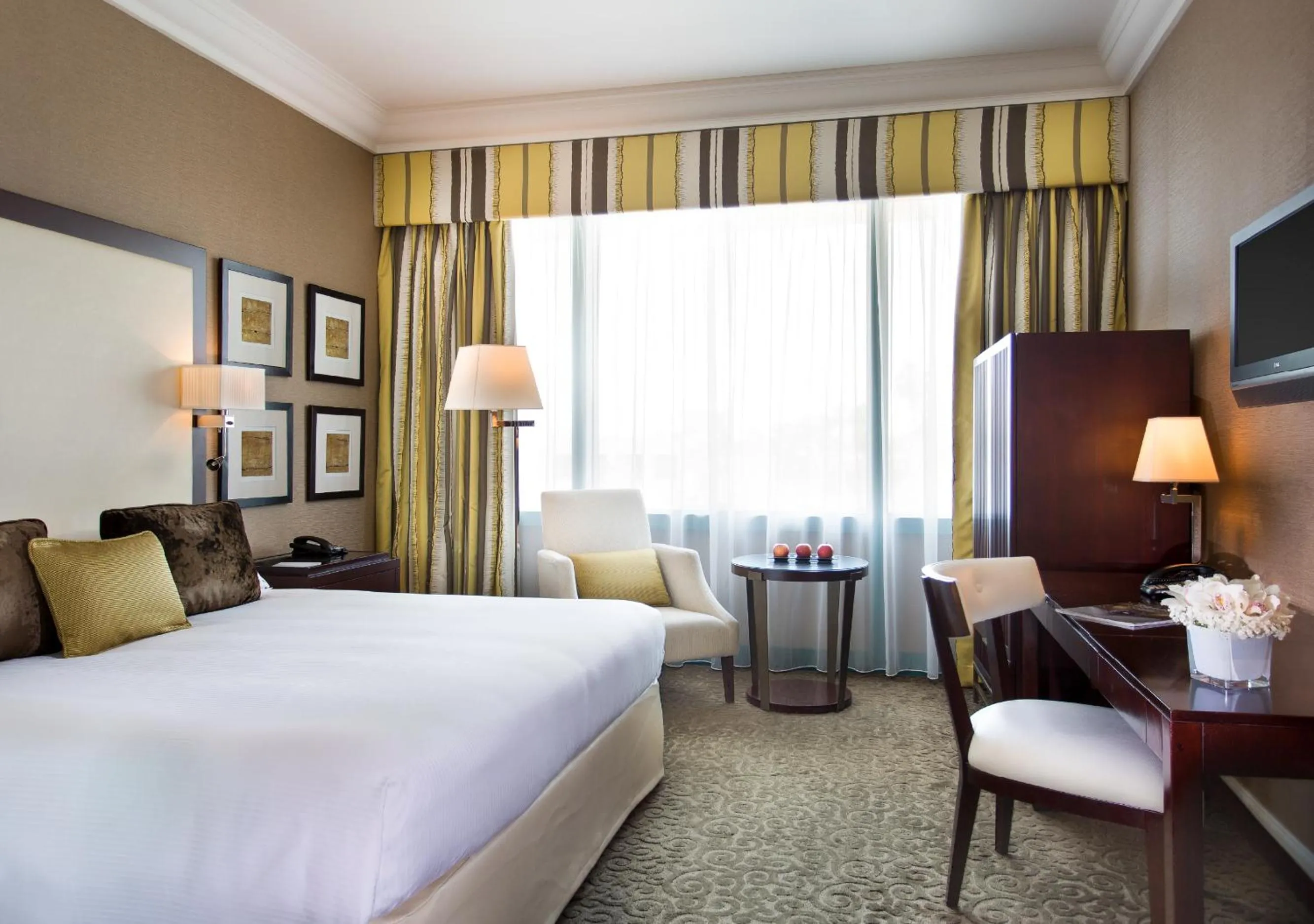 Bed in Mövenpick Grand Al Bustan