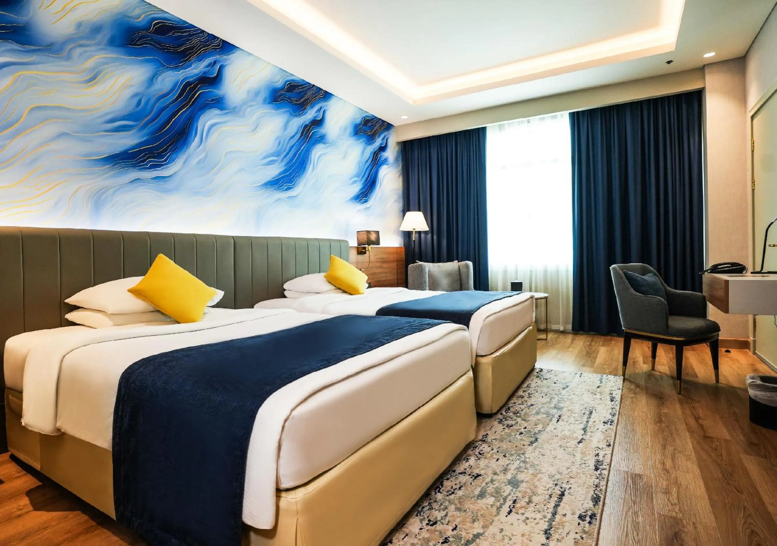 Bed in Mövenpick Grand Al Bustan