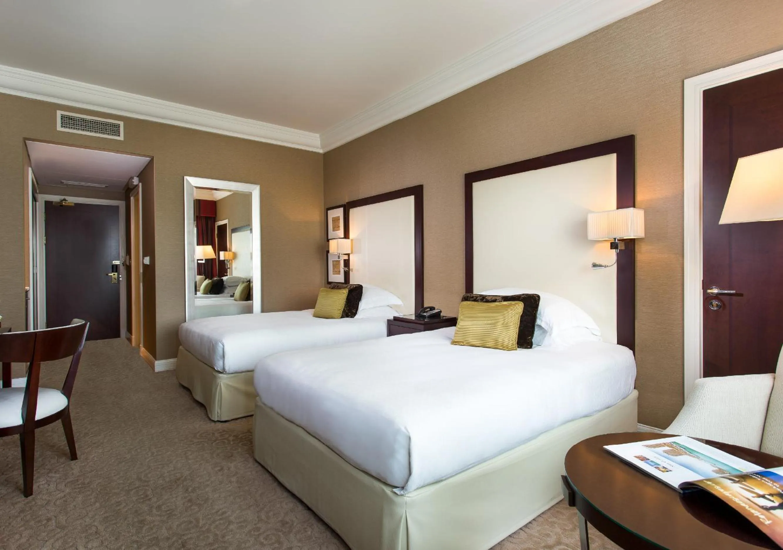 Bed in Mövenpick Grand Al Bustan