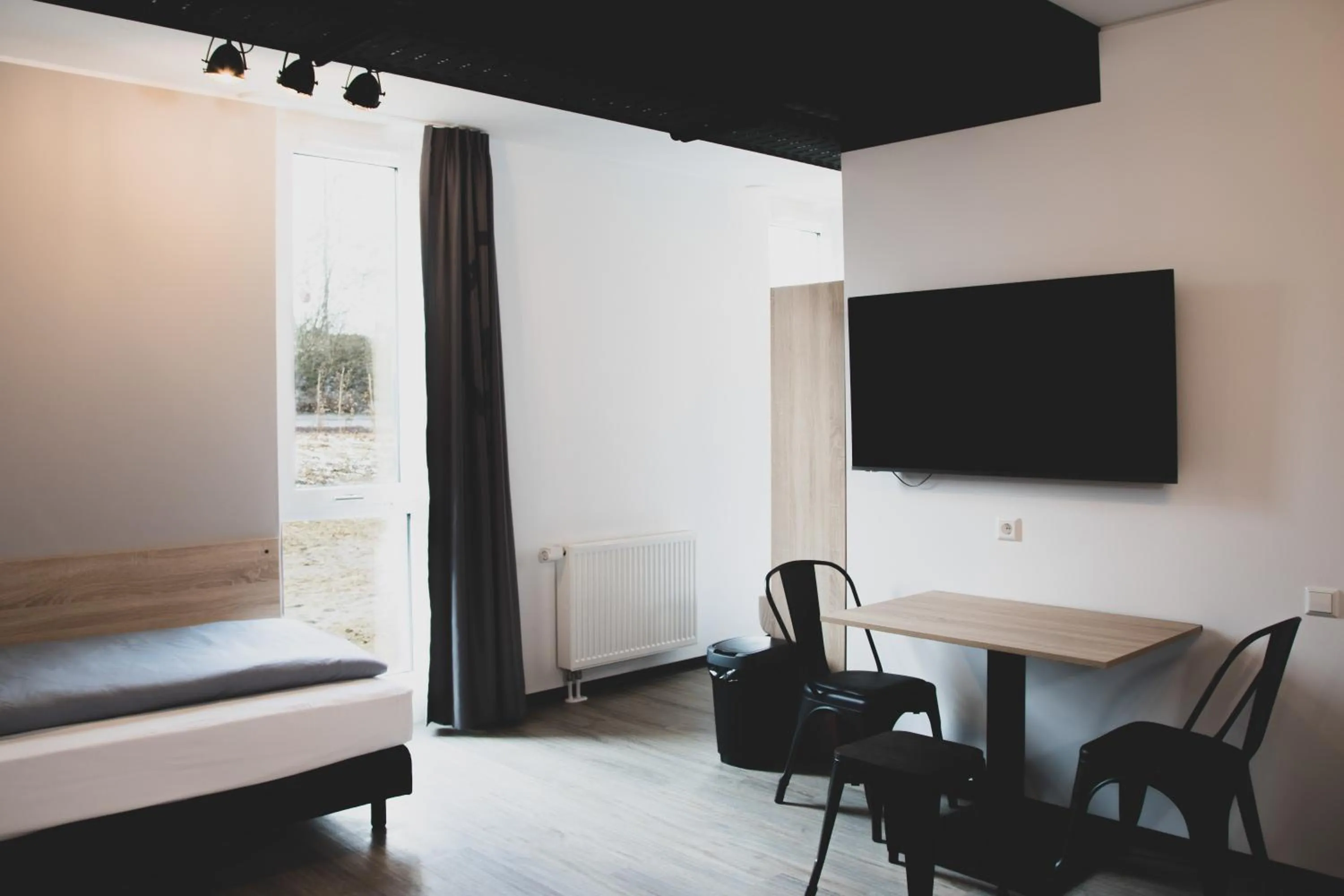 Photo of the whole room, Bed in Das Schlafwerk Stuttgart-Nord -SELF-CHECK IN - keine Rezeption-LowBudget-cashless