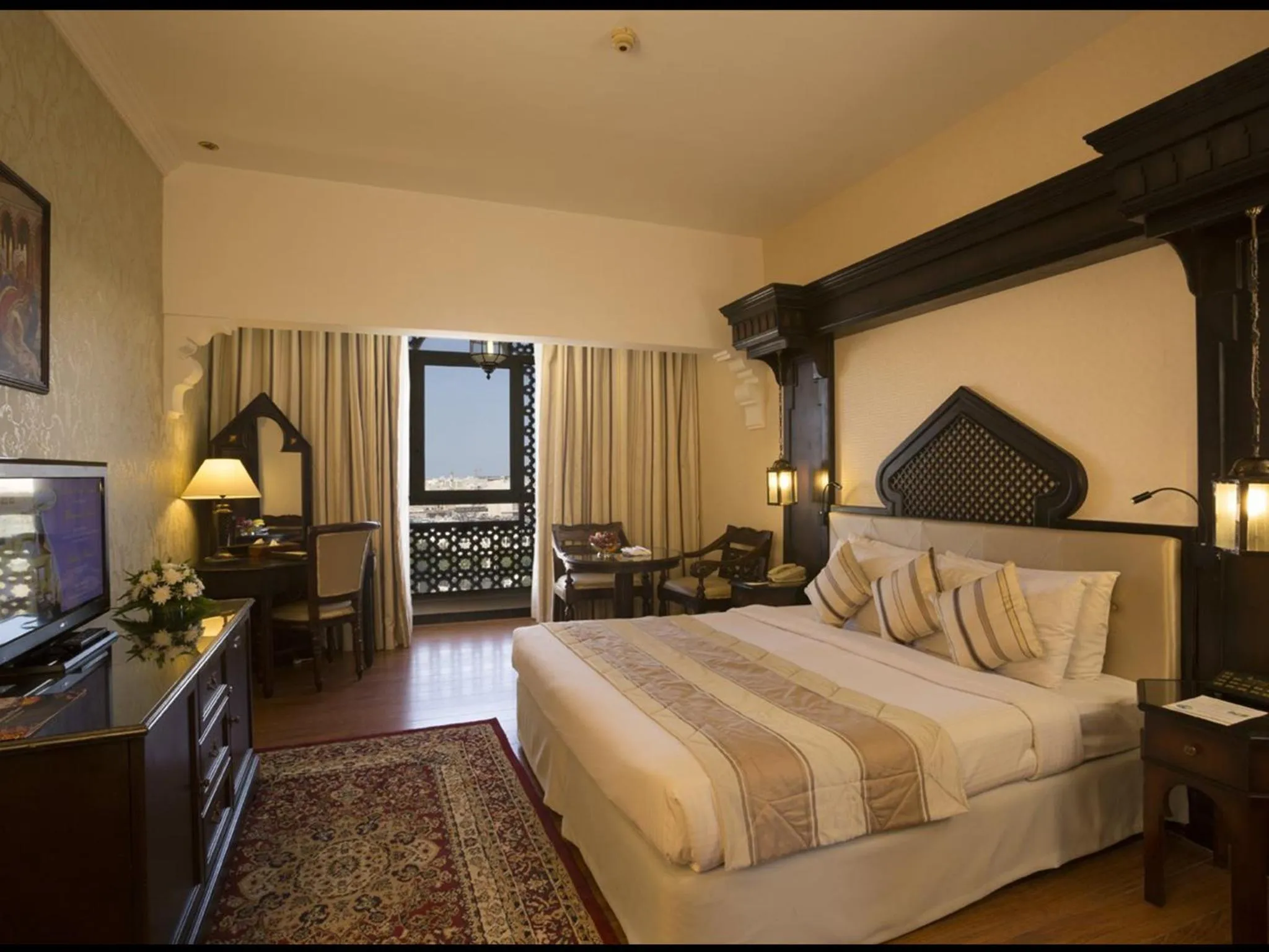 Bed in Arabian Courtyard Hotel & Spa