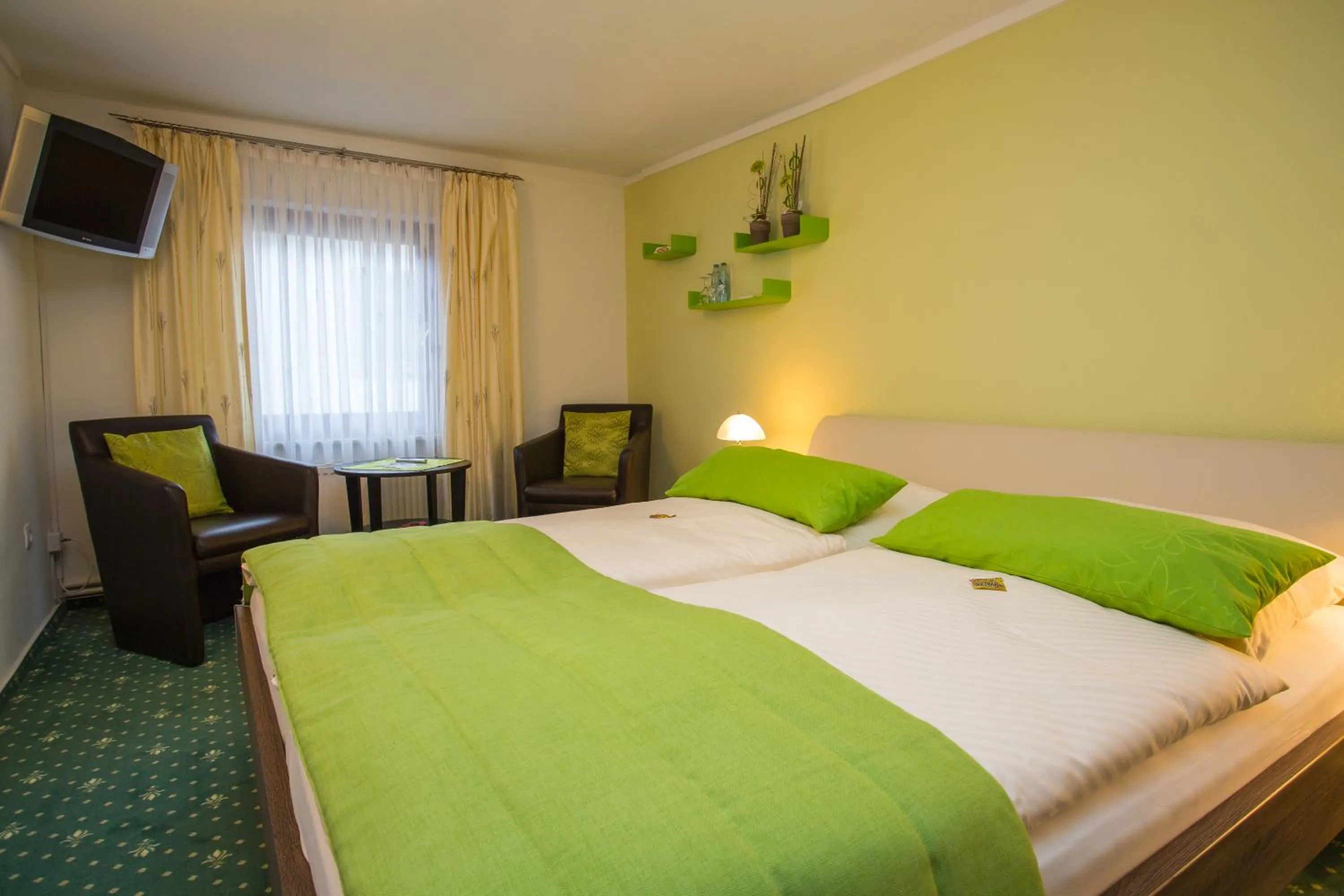 Bed in Hotel Garni Maaß