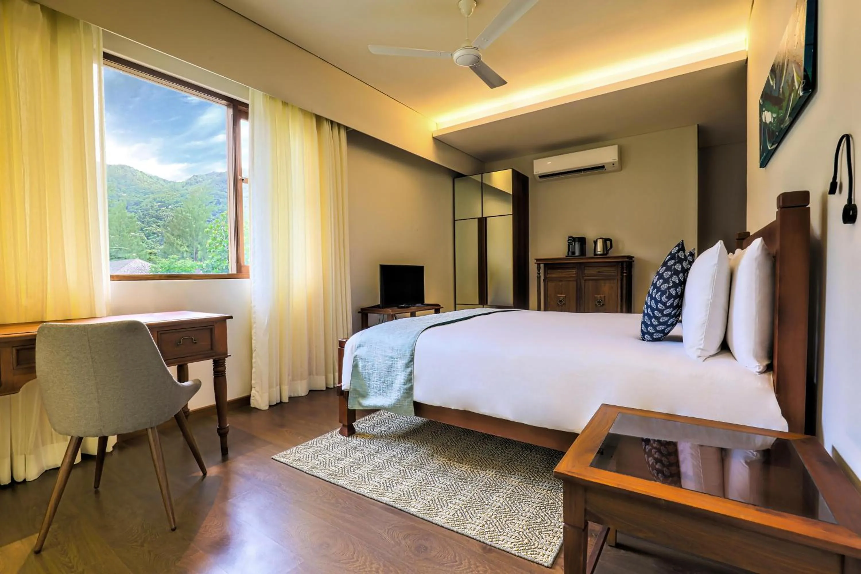 Bed in JA Enchanted Waterfront Seychelles