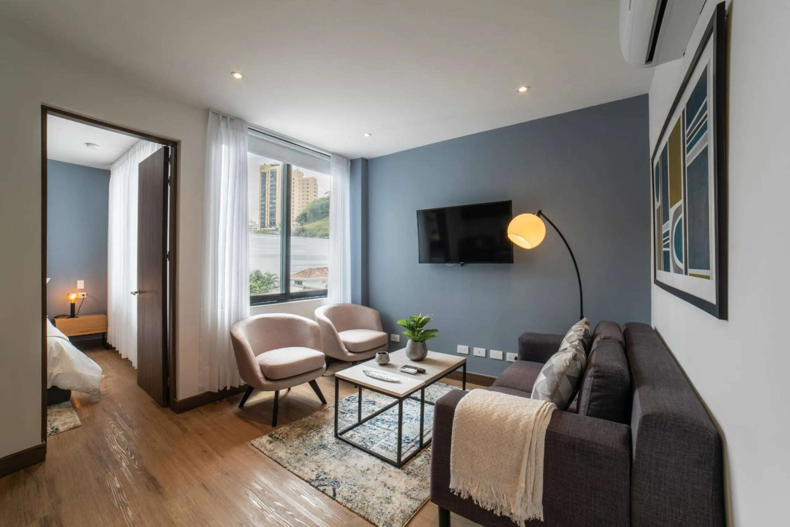 Communal lounge/ TV room in Cali River Suites by Yellowkey Capital