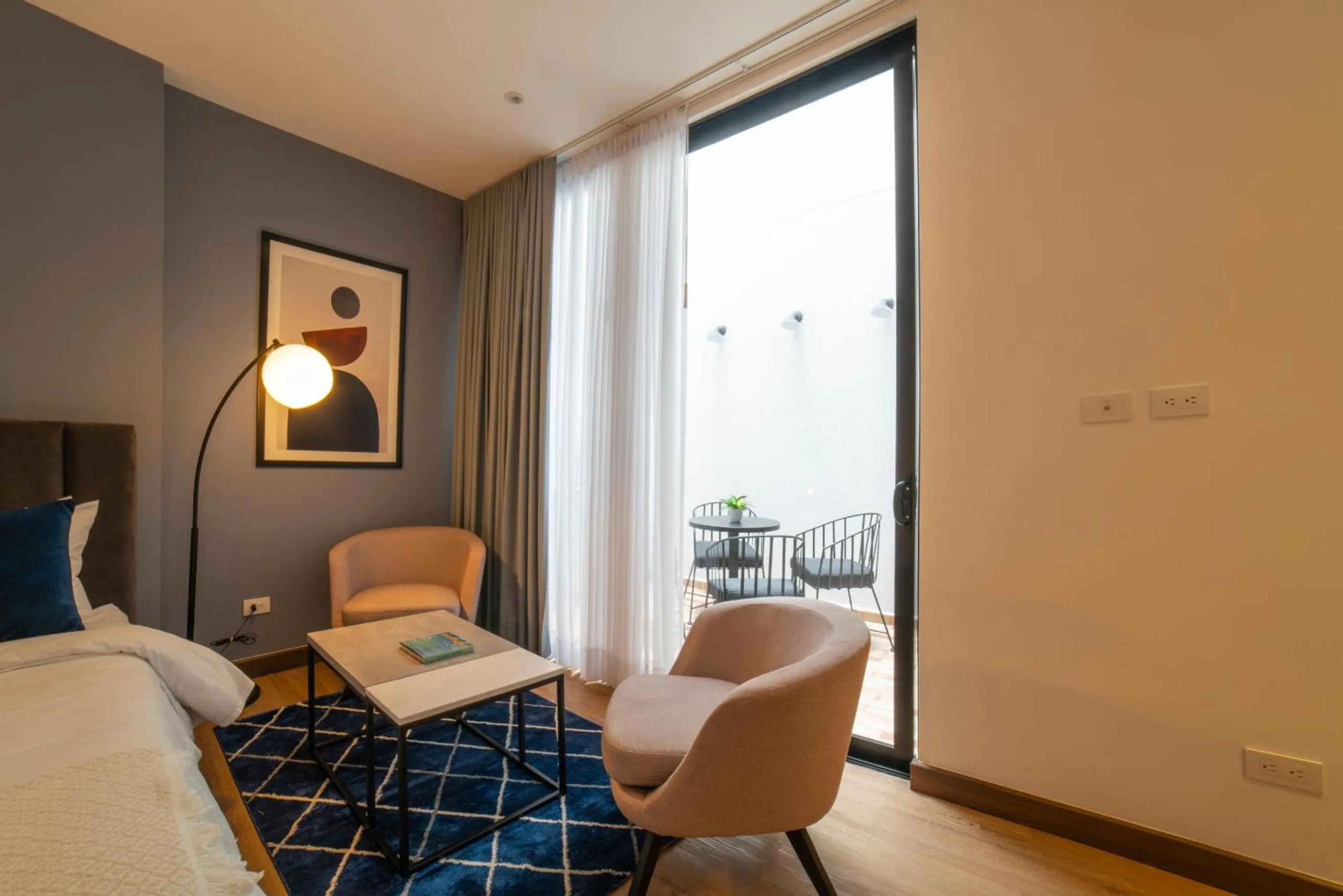 Communal lounge/ TV room, Bed in Cali River Suites by Yellowkey Capital