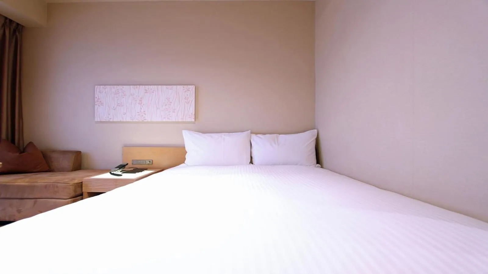 Bed in KOKO HOTEL Fukuoka Tenjin