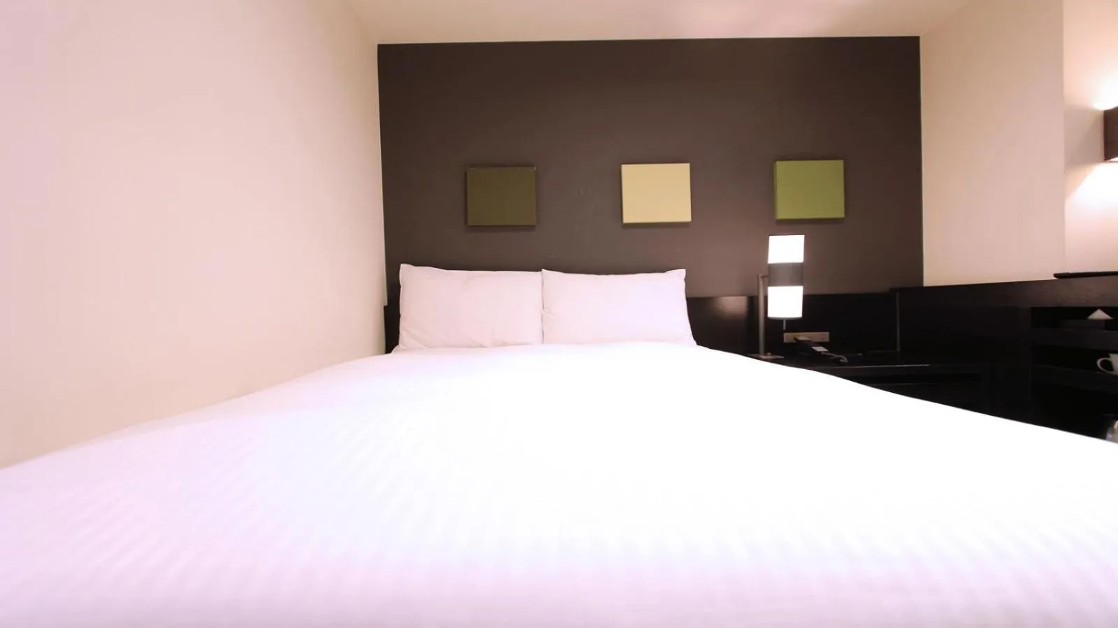 Bed in KOKO HOTEL Fukuoka Tenjin