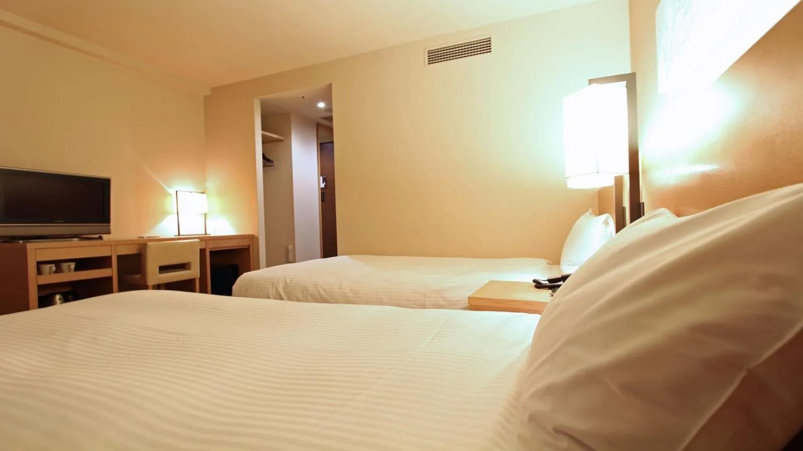 Bed in KOKO HOTEL Fukuoka Tenjin