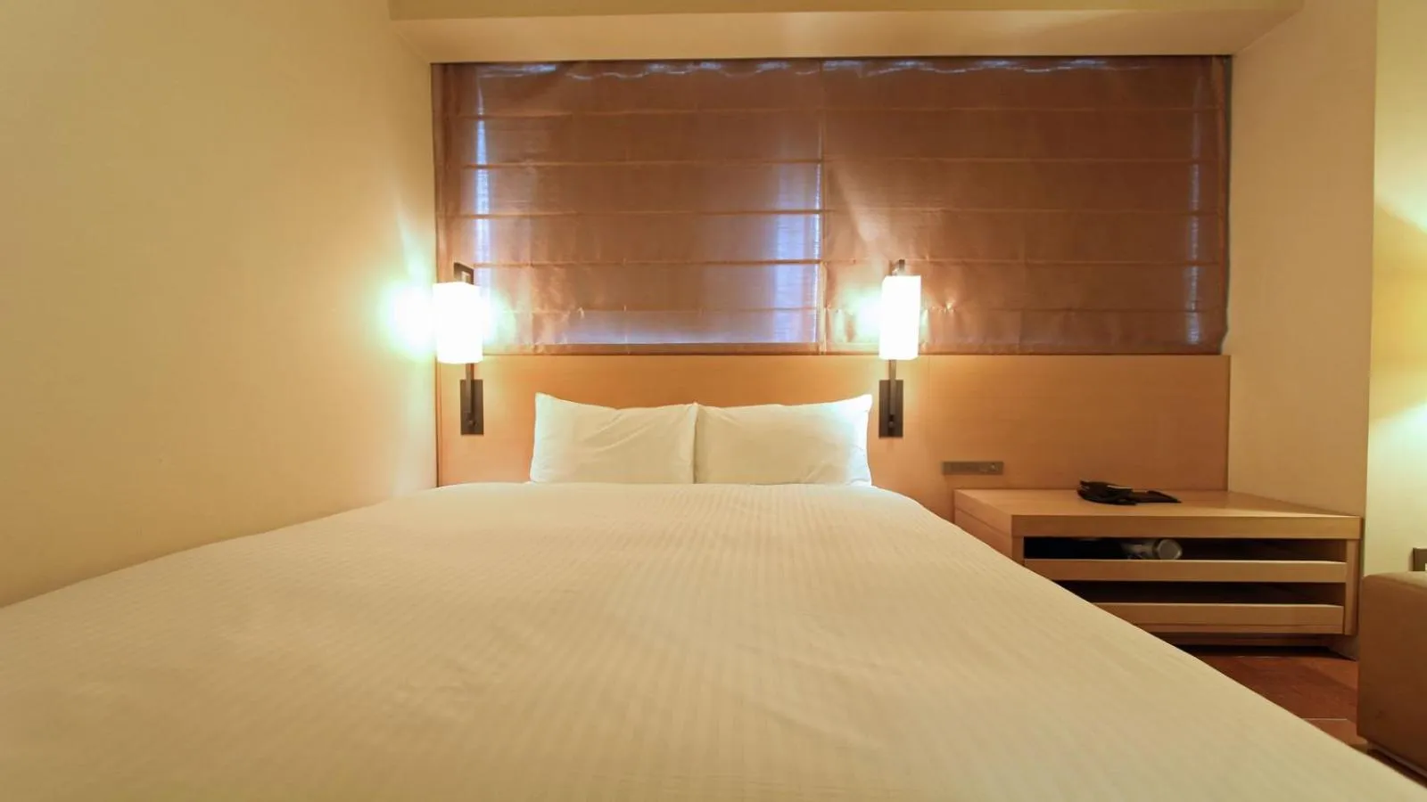 Bed in KOKO HOTEL Fukuoka Tenjin