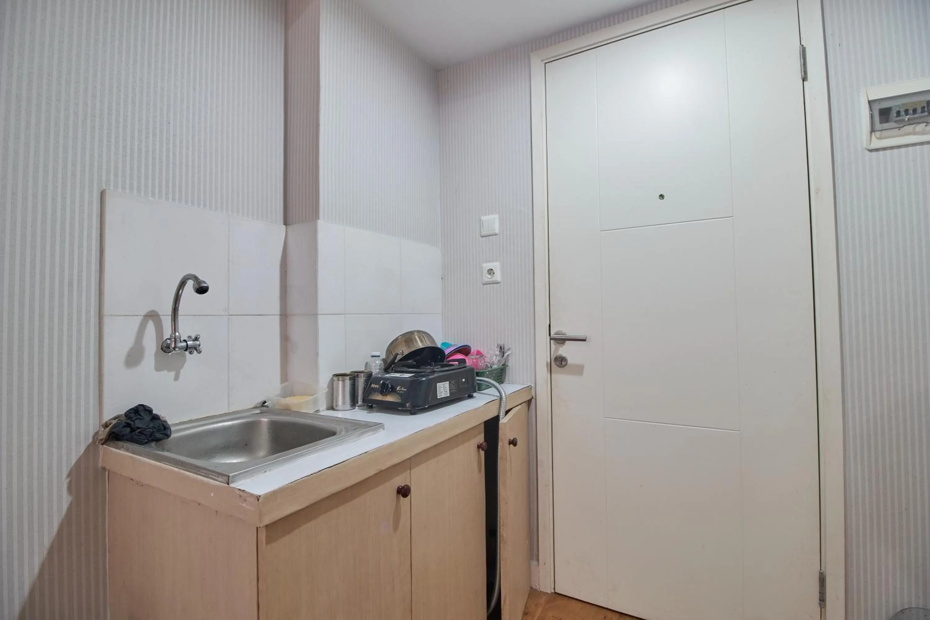 Kitchen or kitchenette in Room Rendi @ Apt Dramaga Tower