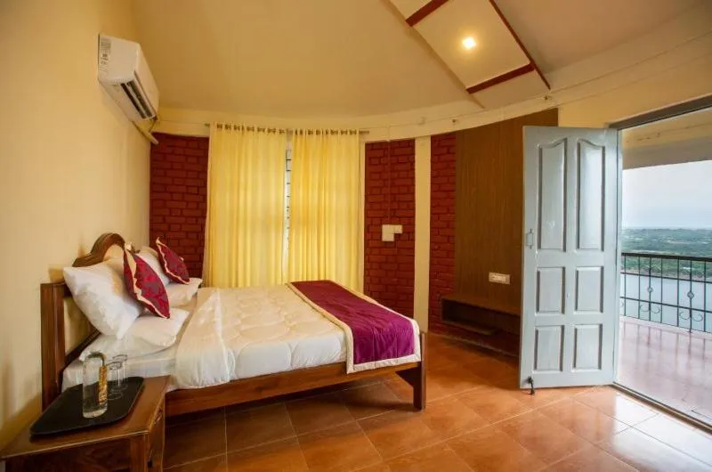 Bed in KSTDC Hotel Mayura Krishna Almatti